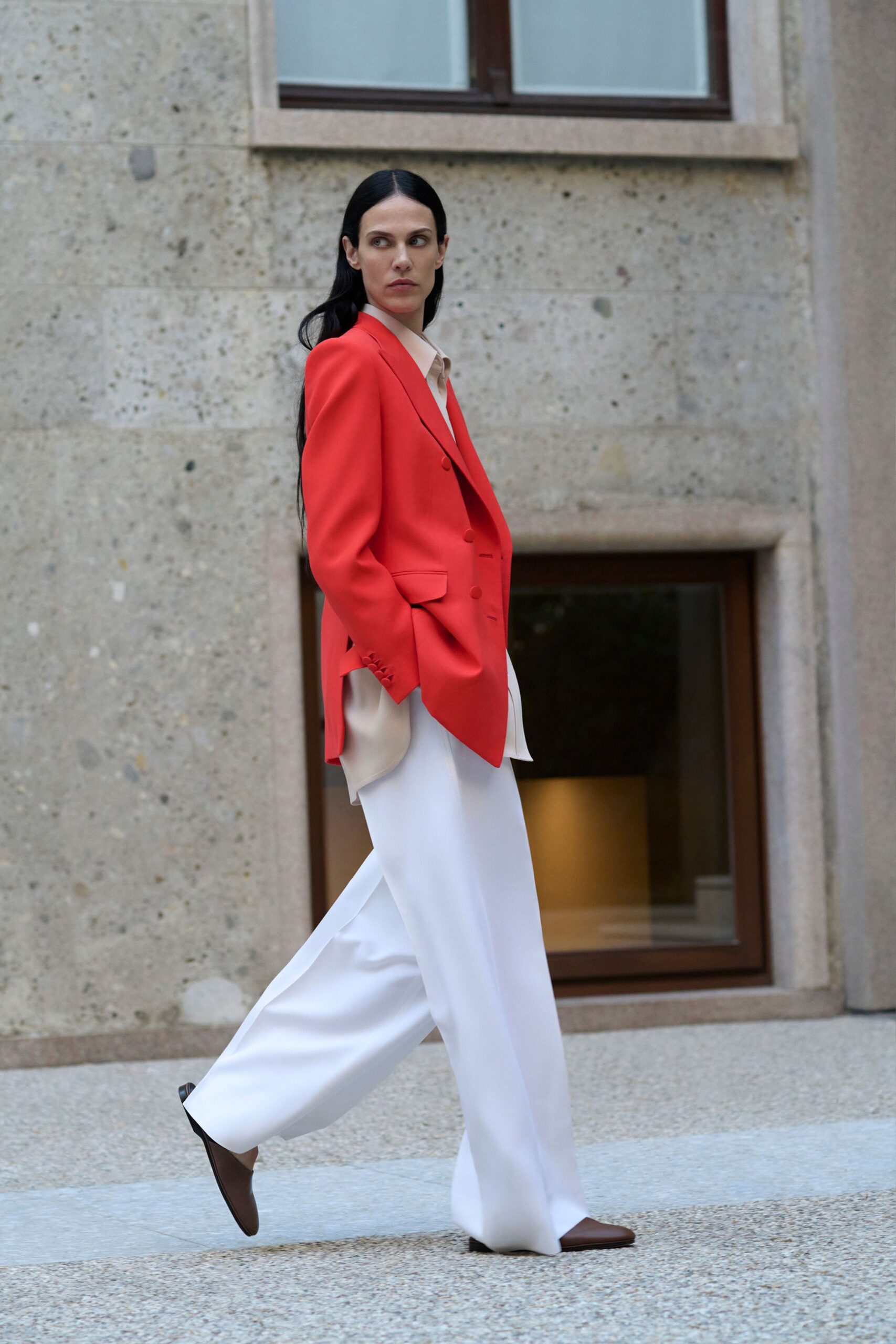red tailored blazer with beige shirt