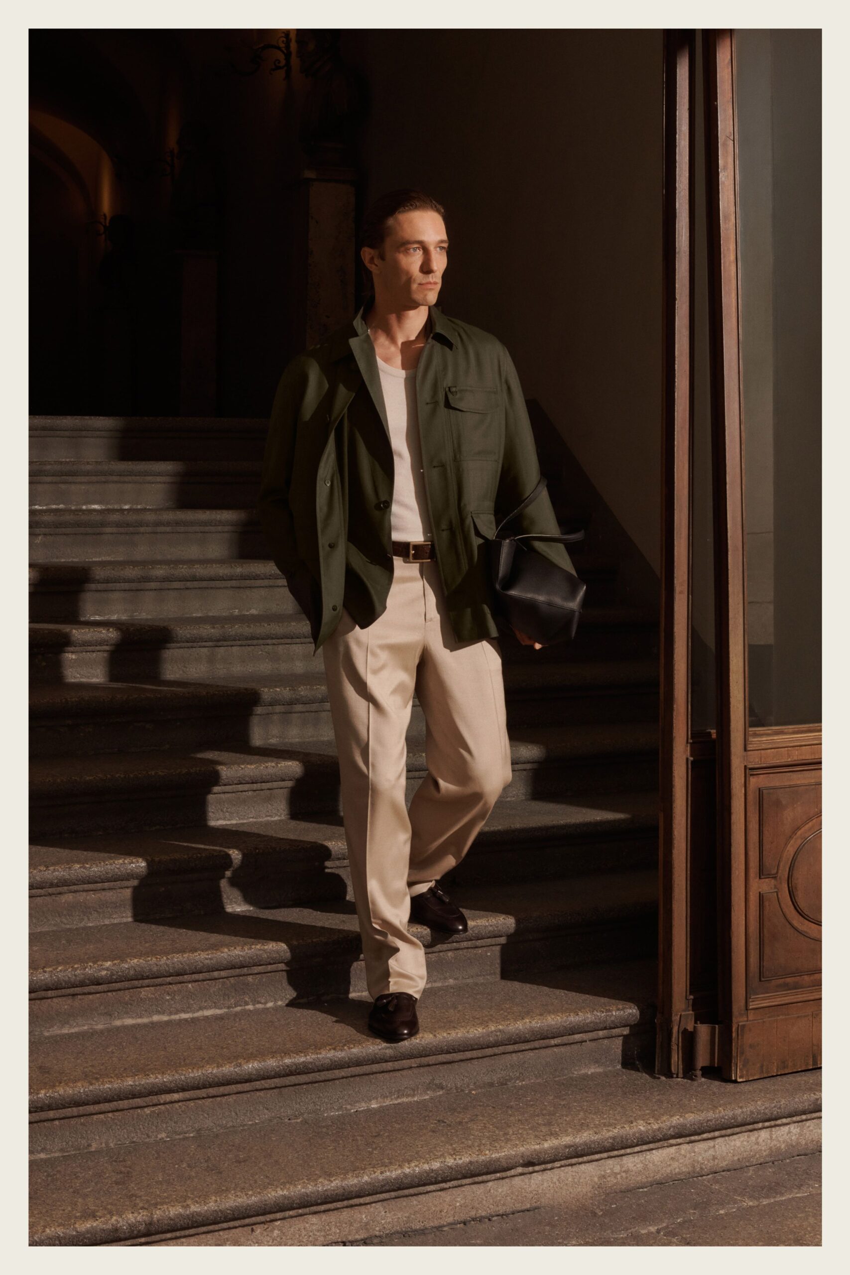 green jacket with beige pants