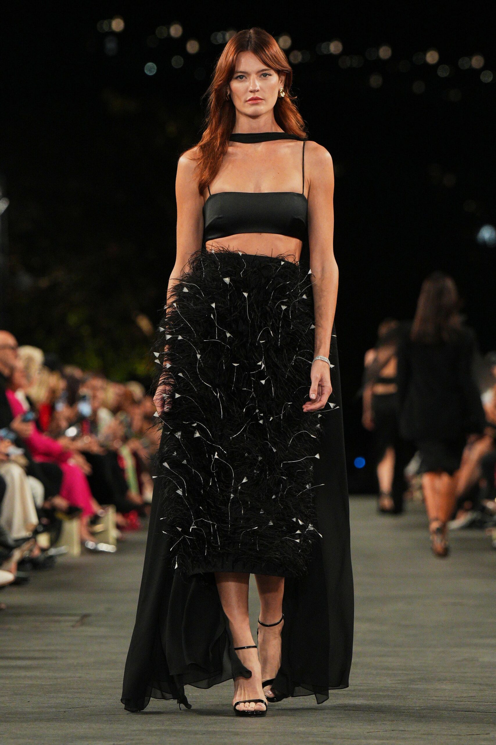 black cropped top and feather skirt