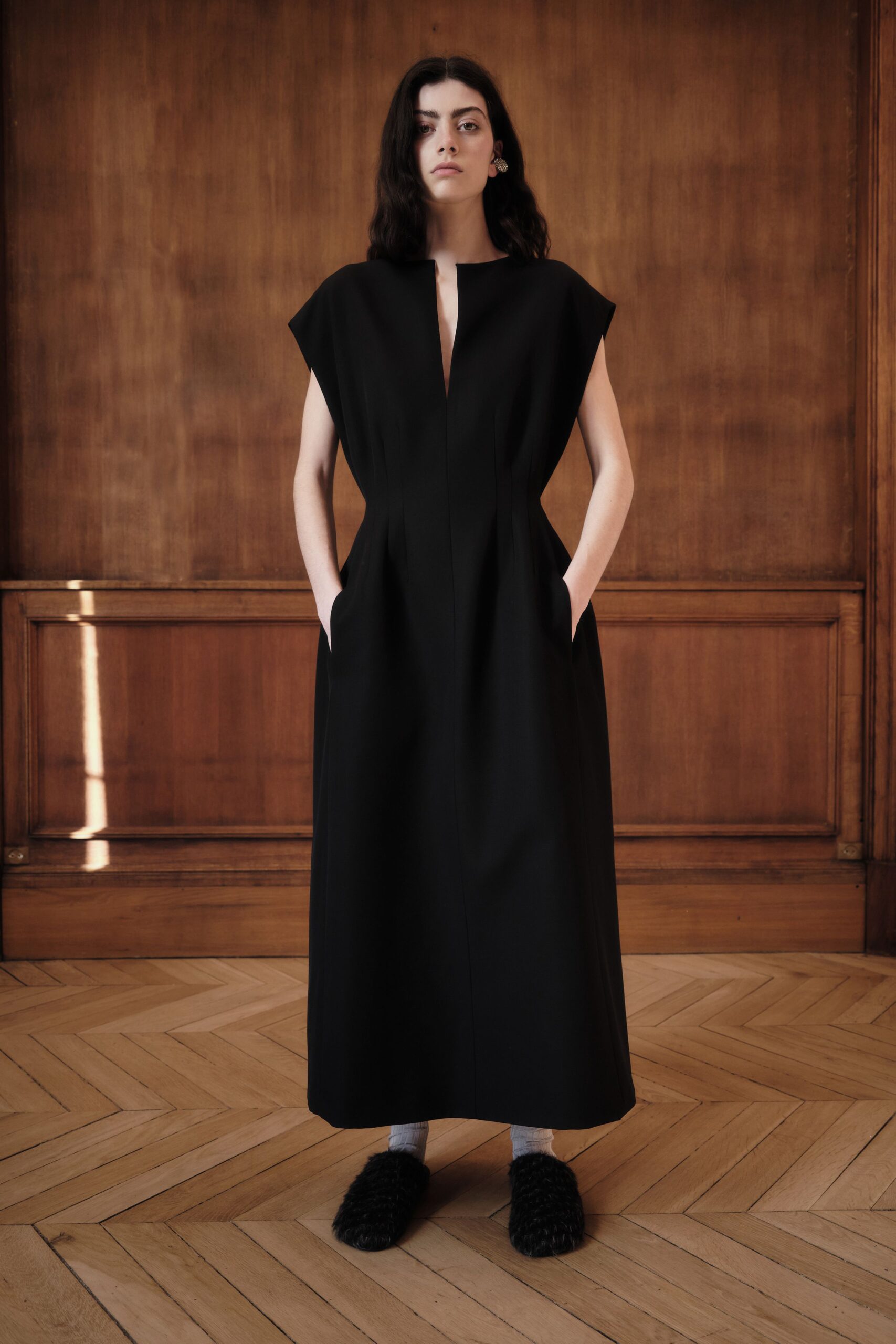 black fitted gown with fur shoes