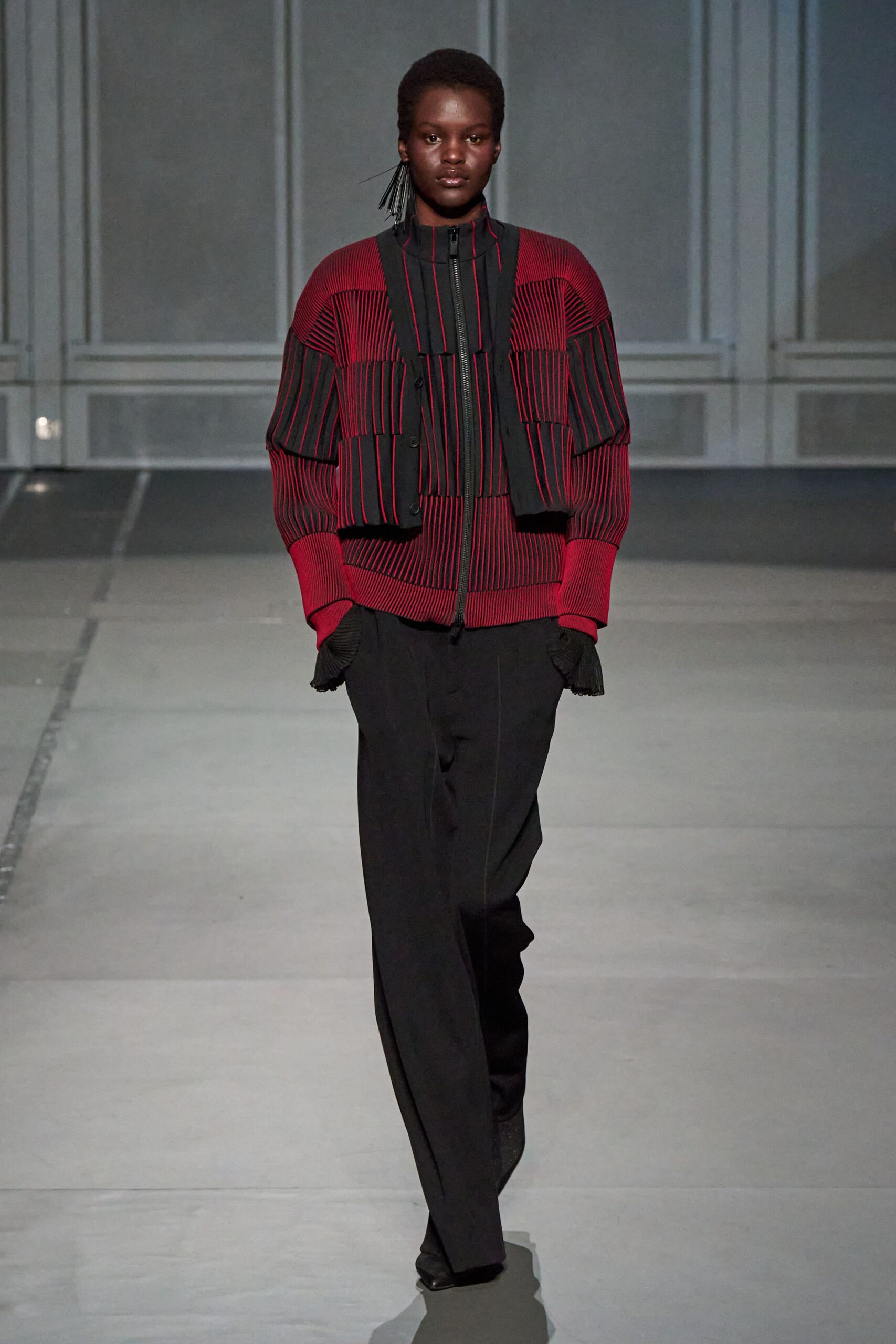 red and black fitted jacket with slim pants