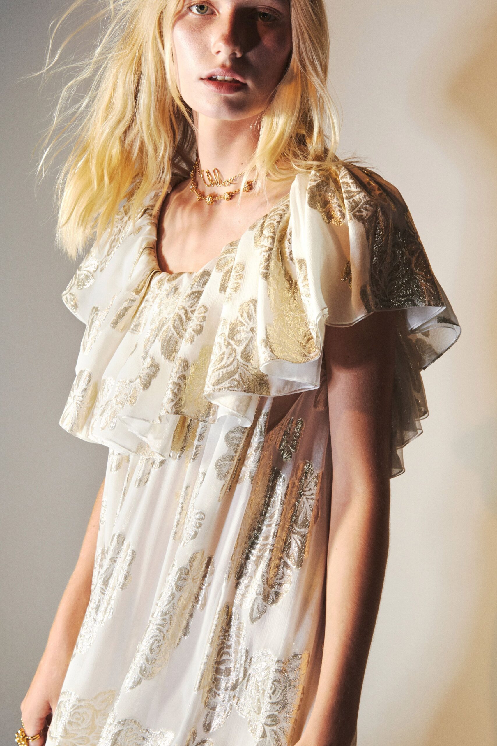 white gold ruffled floral dress