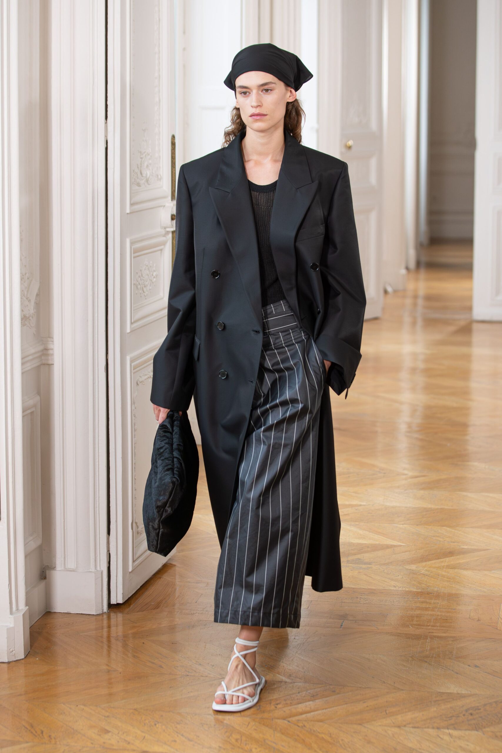 black oversized coat with striped pants