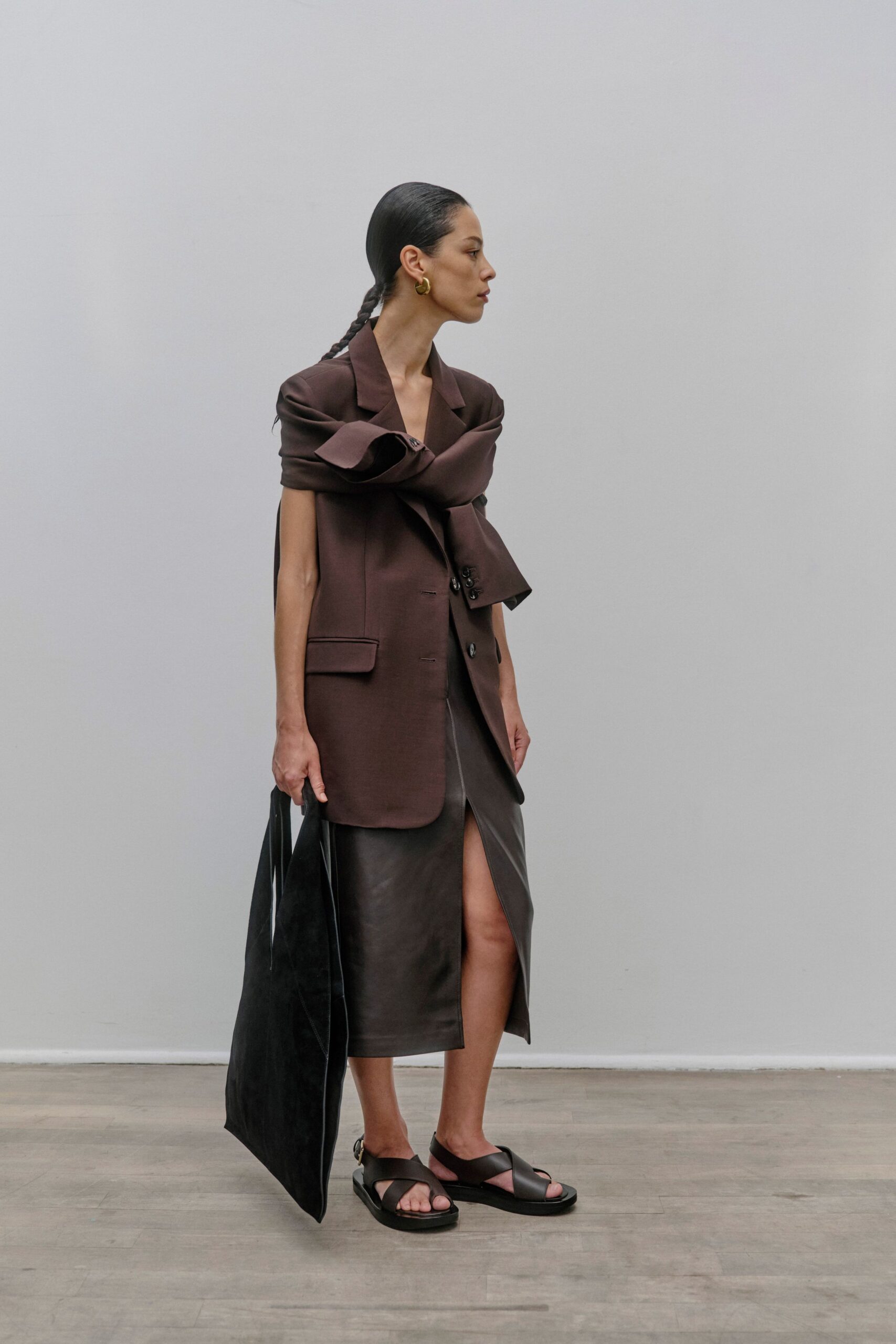 brown tailored blazer with black leather skirt