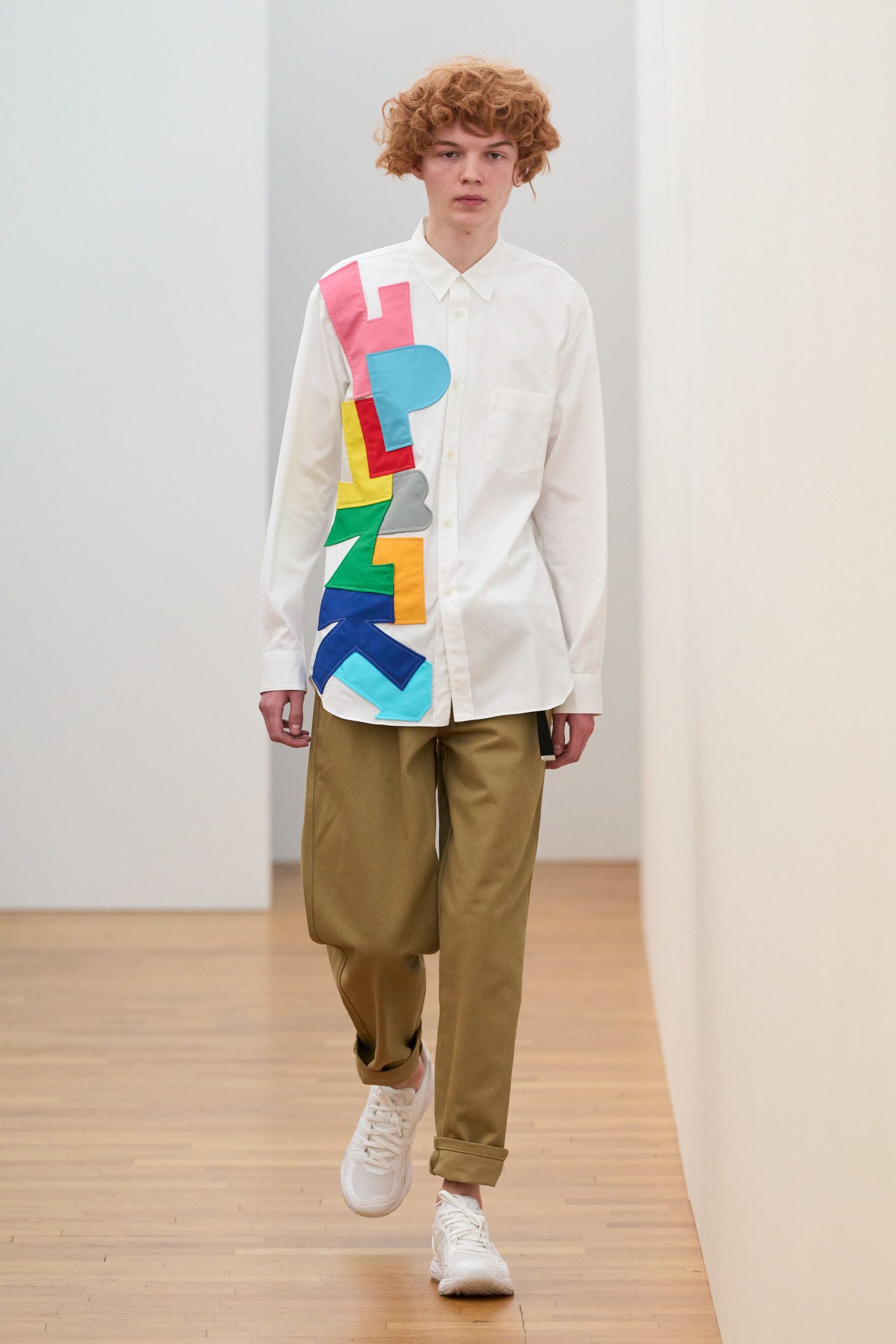 color-blocked white shirt with beige pants