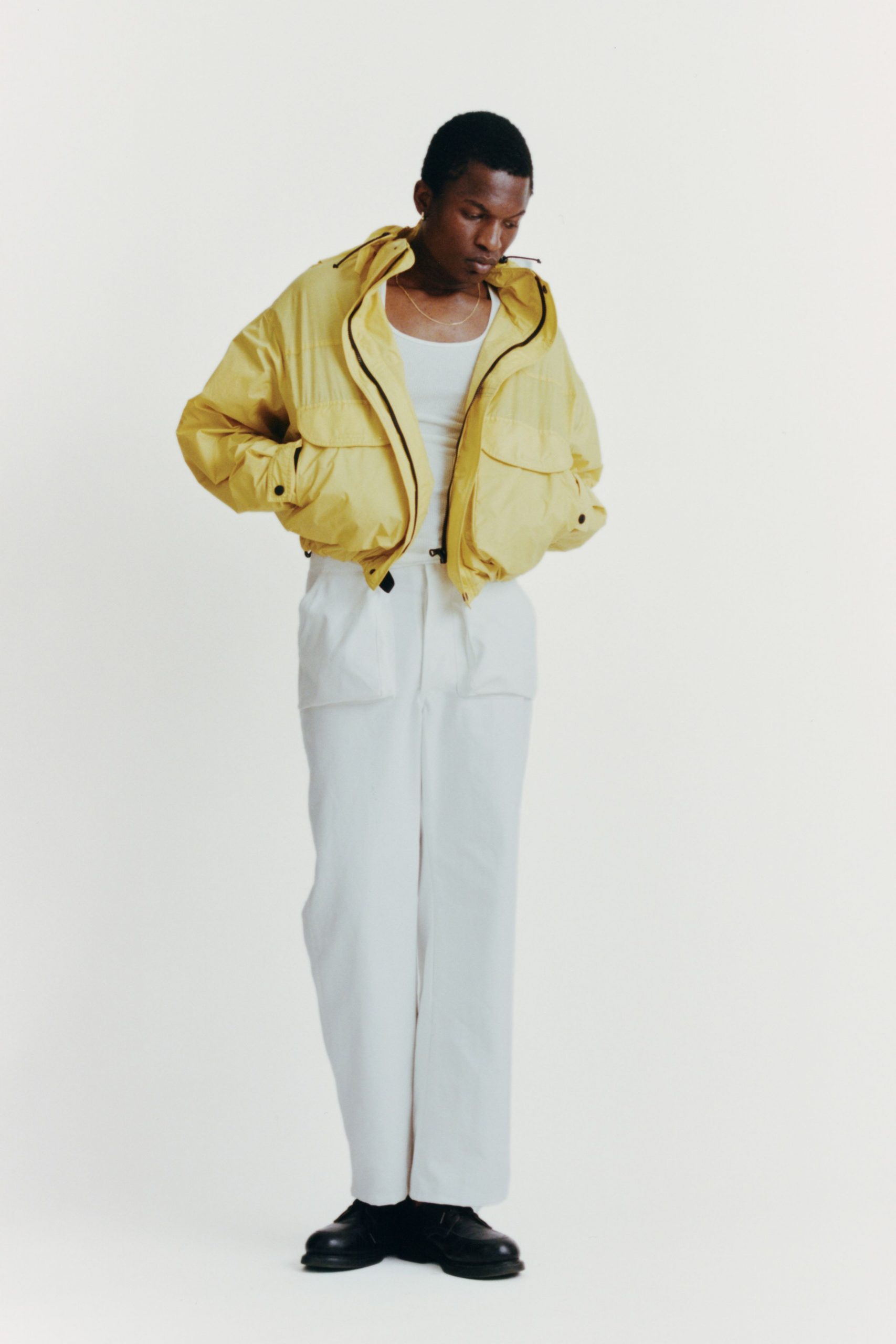 yellow jacket white tank top pants