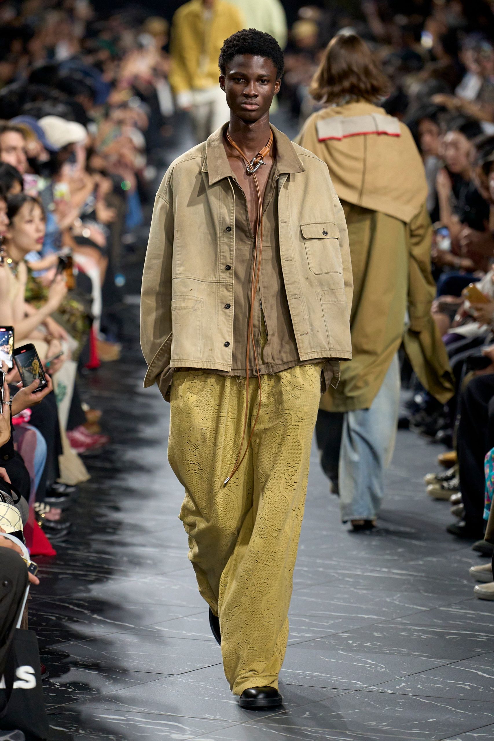 beige jacket brown shirt yellow pants