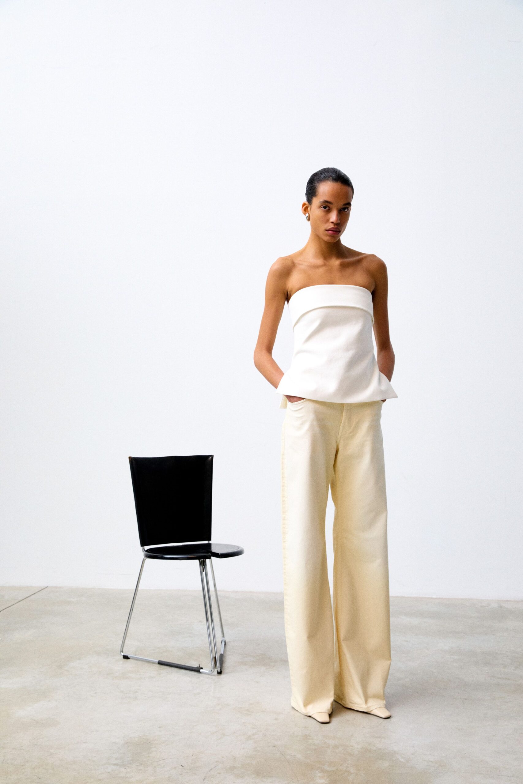 white fitted top beige wide-leg pants