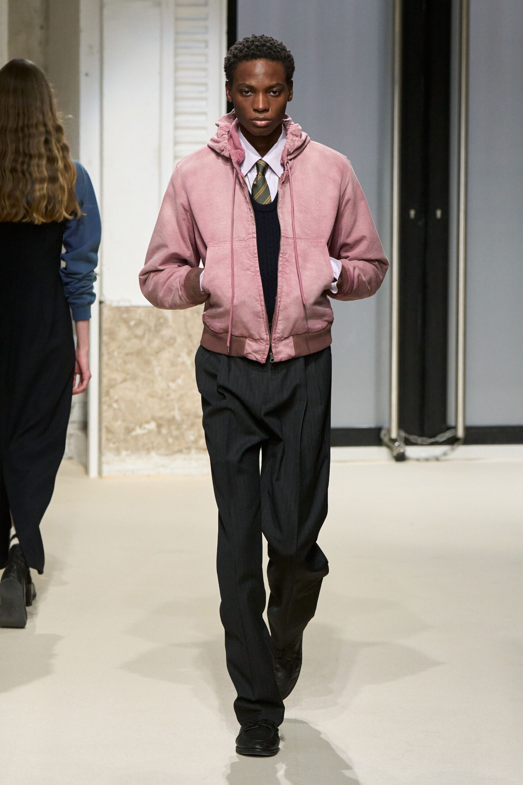 pink jacket black sweater tailored pants