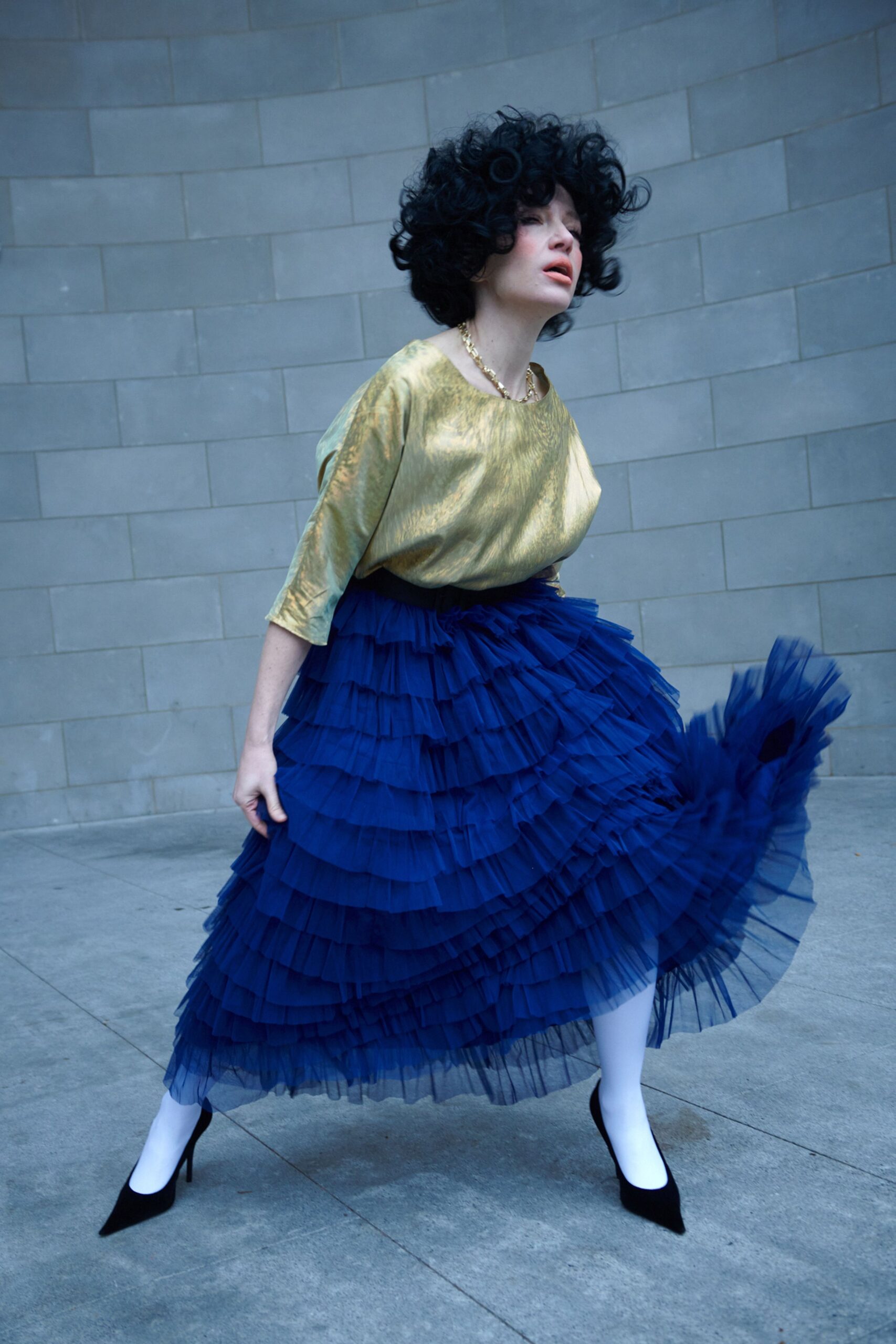 gold top blue tiered skirt