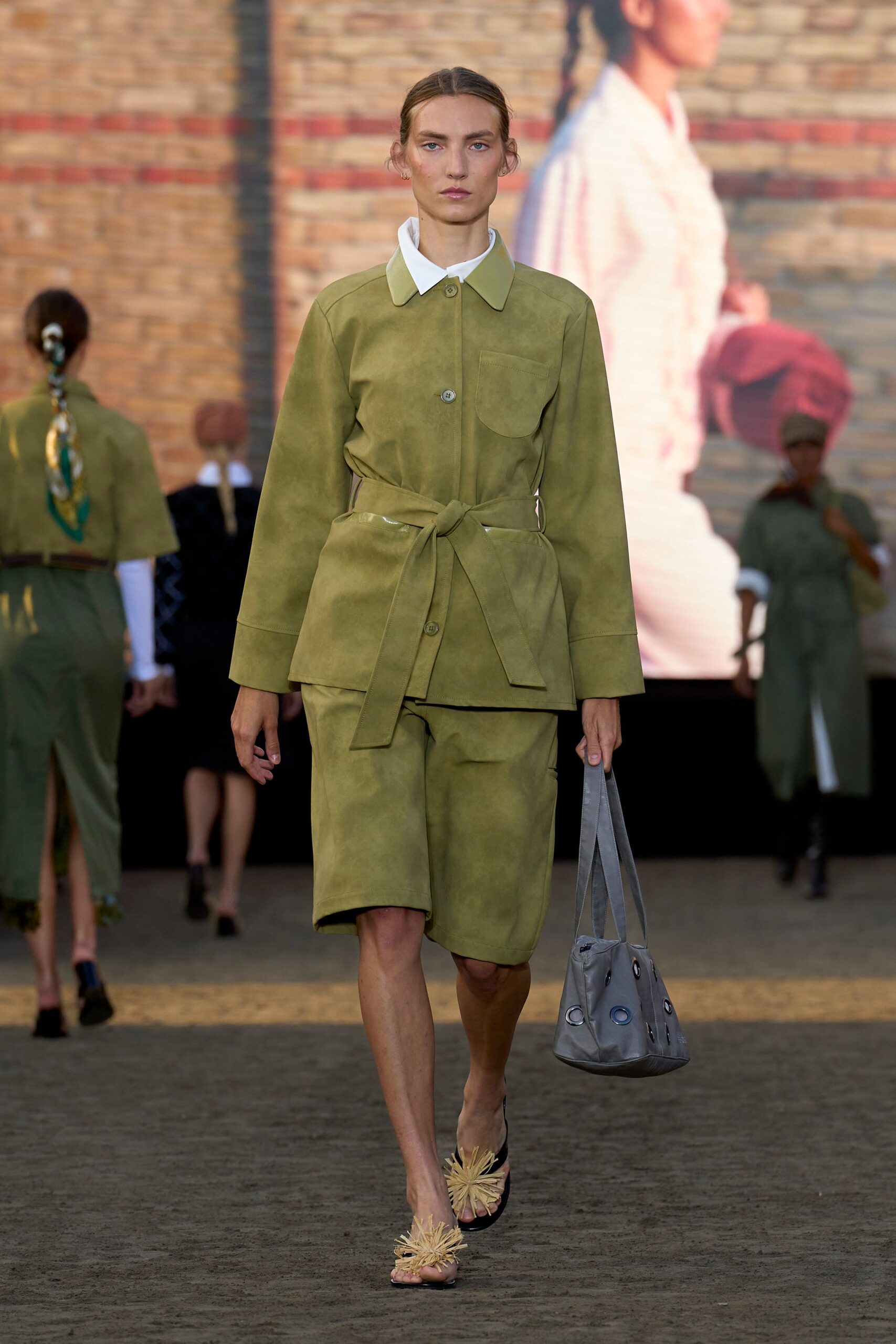 green suede long-sleeve collared structured buttoned pockets jacket