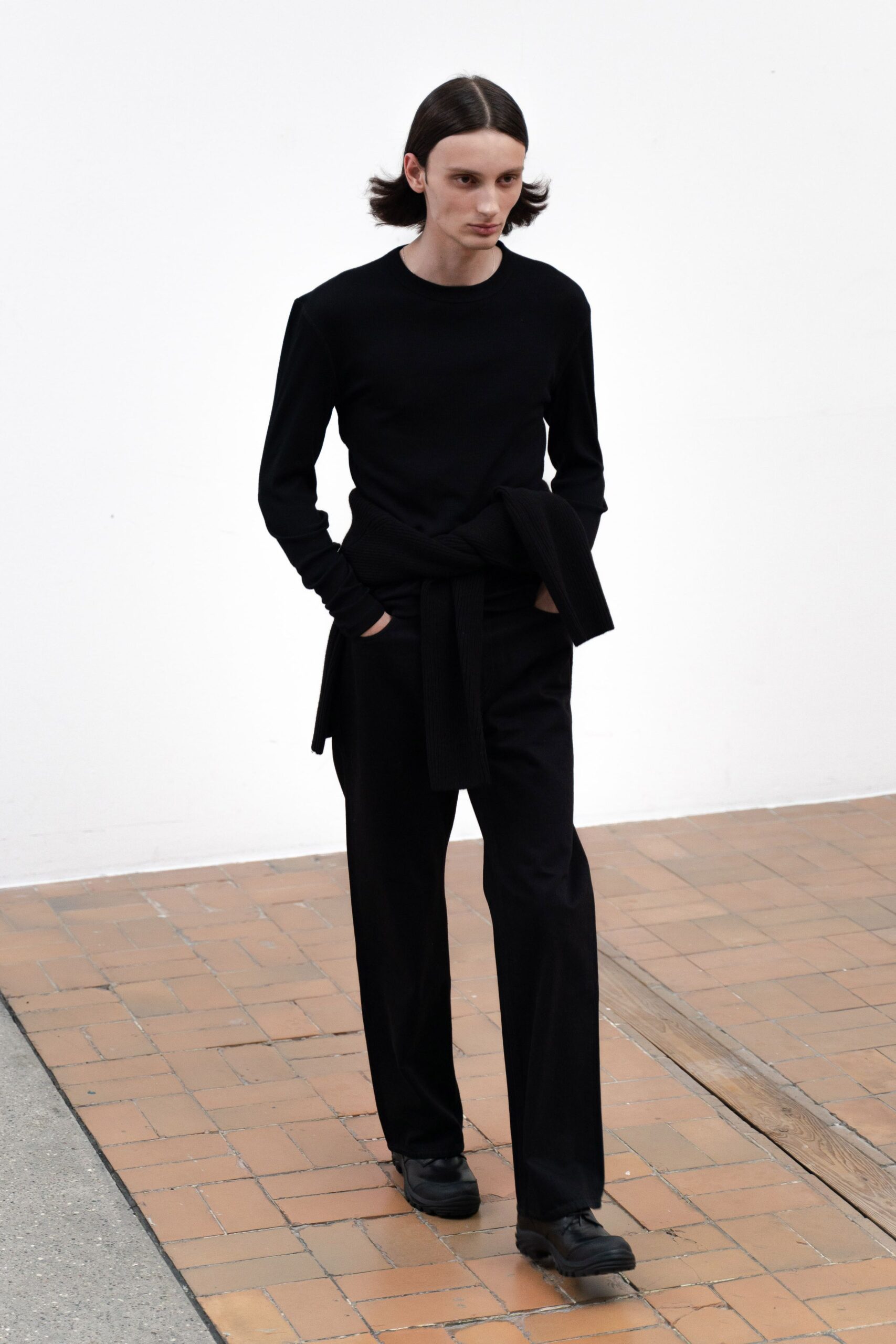 black fitted top and relaxed pants