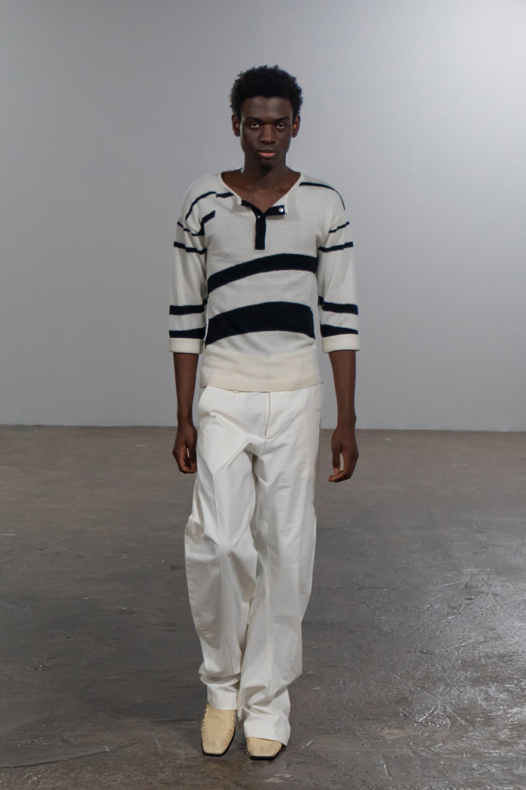 striped sweater and white pants