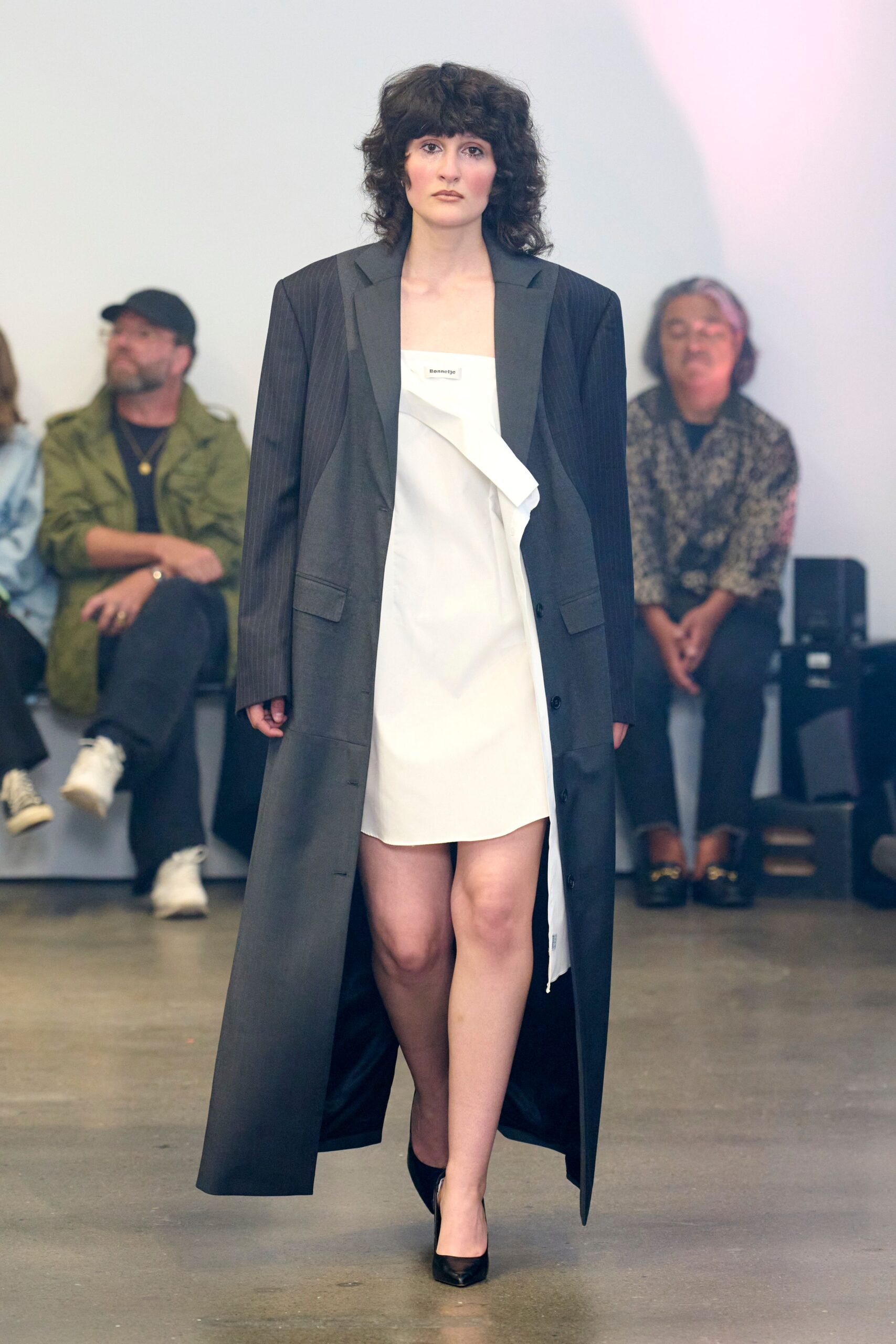 black wool long-sleeve collared oversized buttoned pockets coat