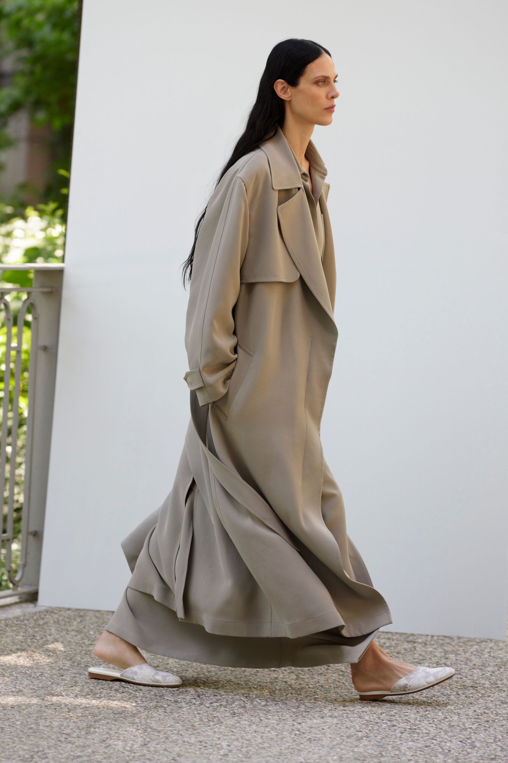 beige relaxed silk coat with white shoes