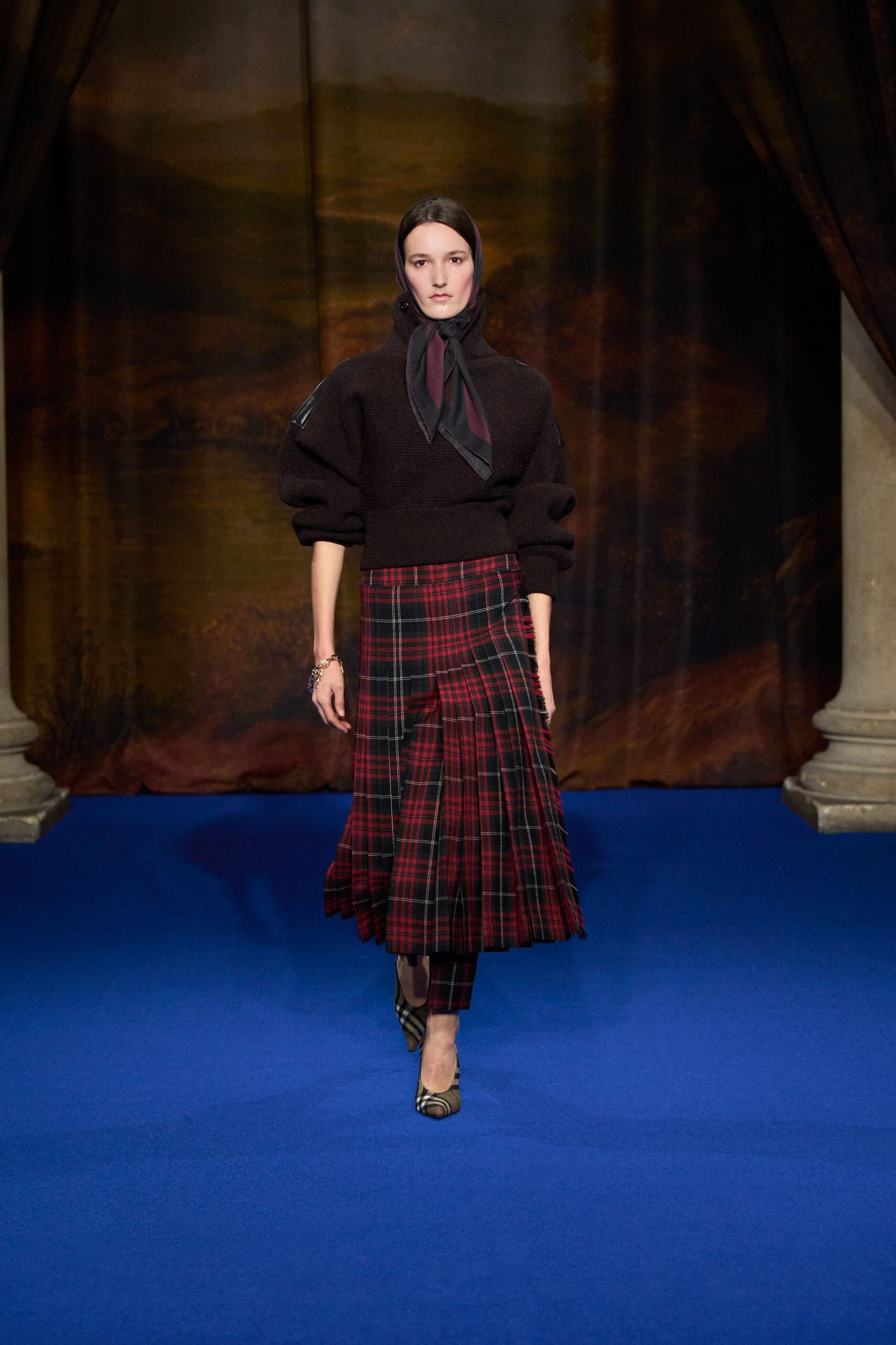 black sweater red plaid skirt