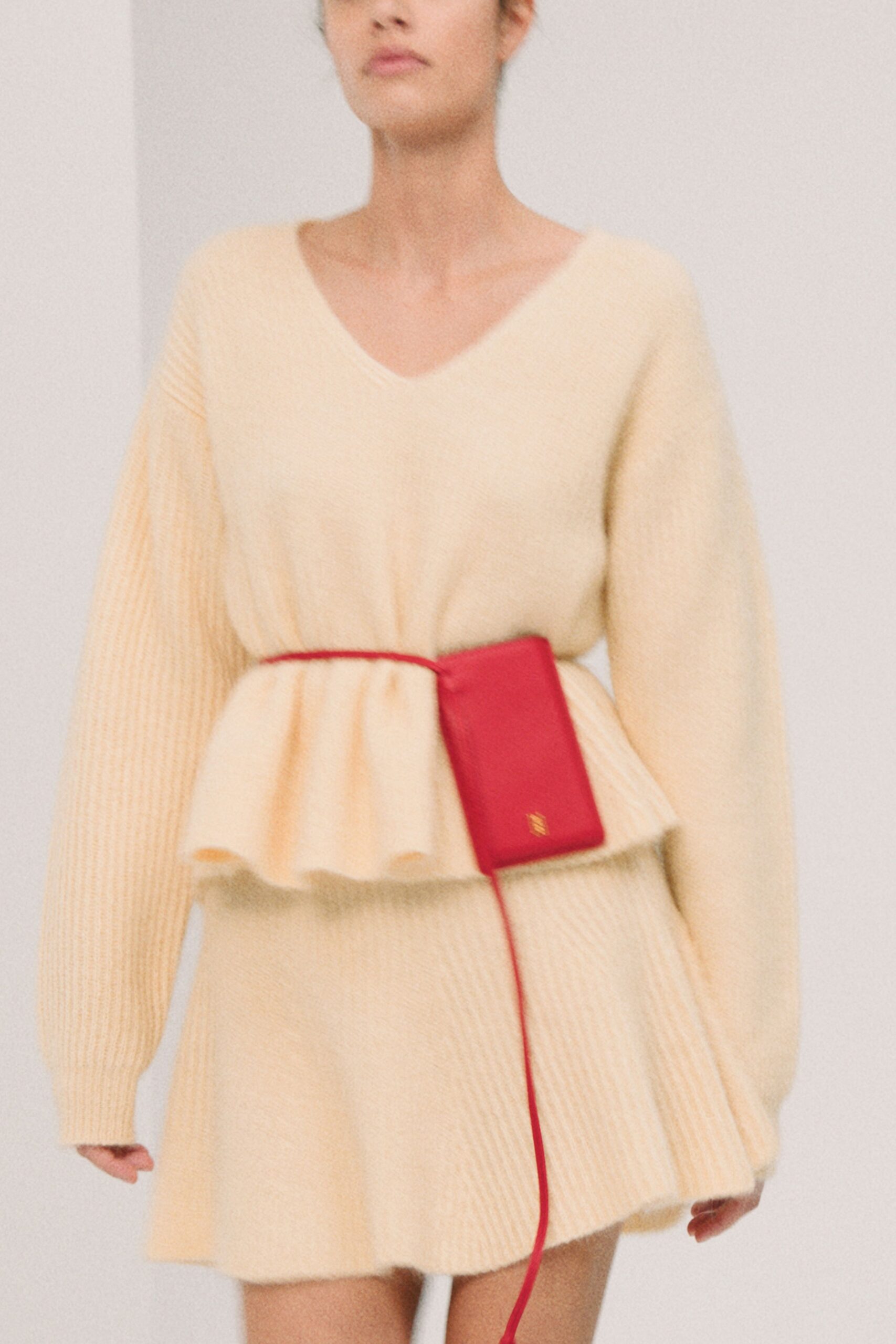 beige knit long-sleeve v-neck relaxed pleated mini dress