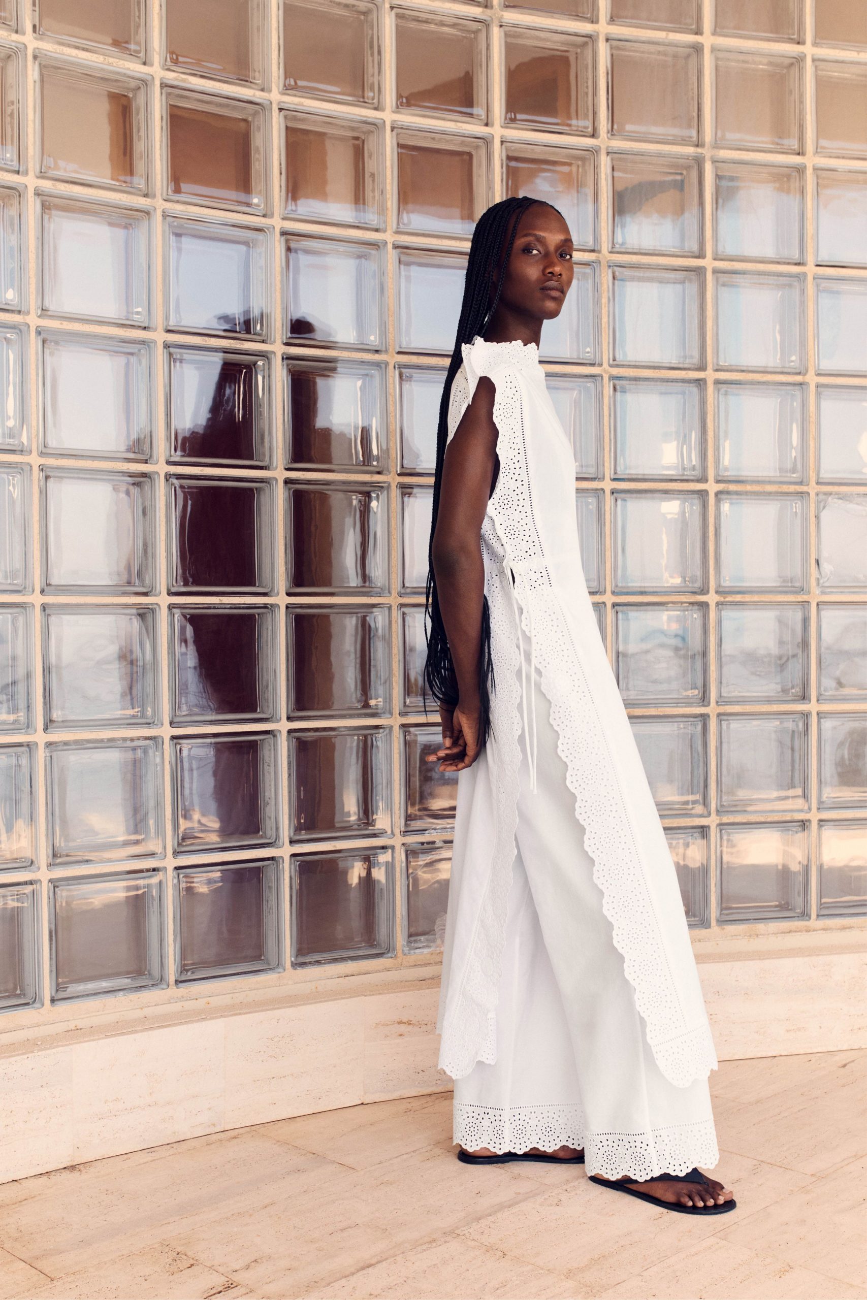 white embroidered sleeveless gown