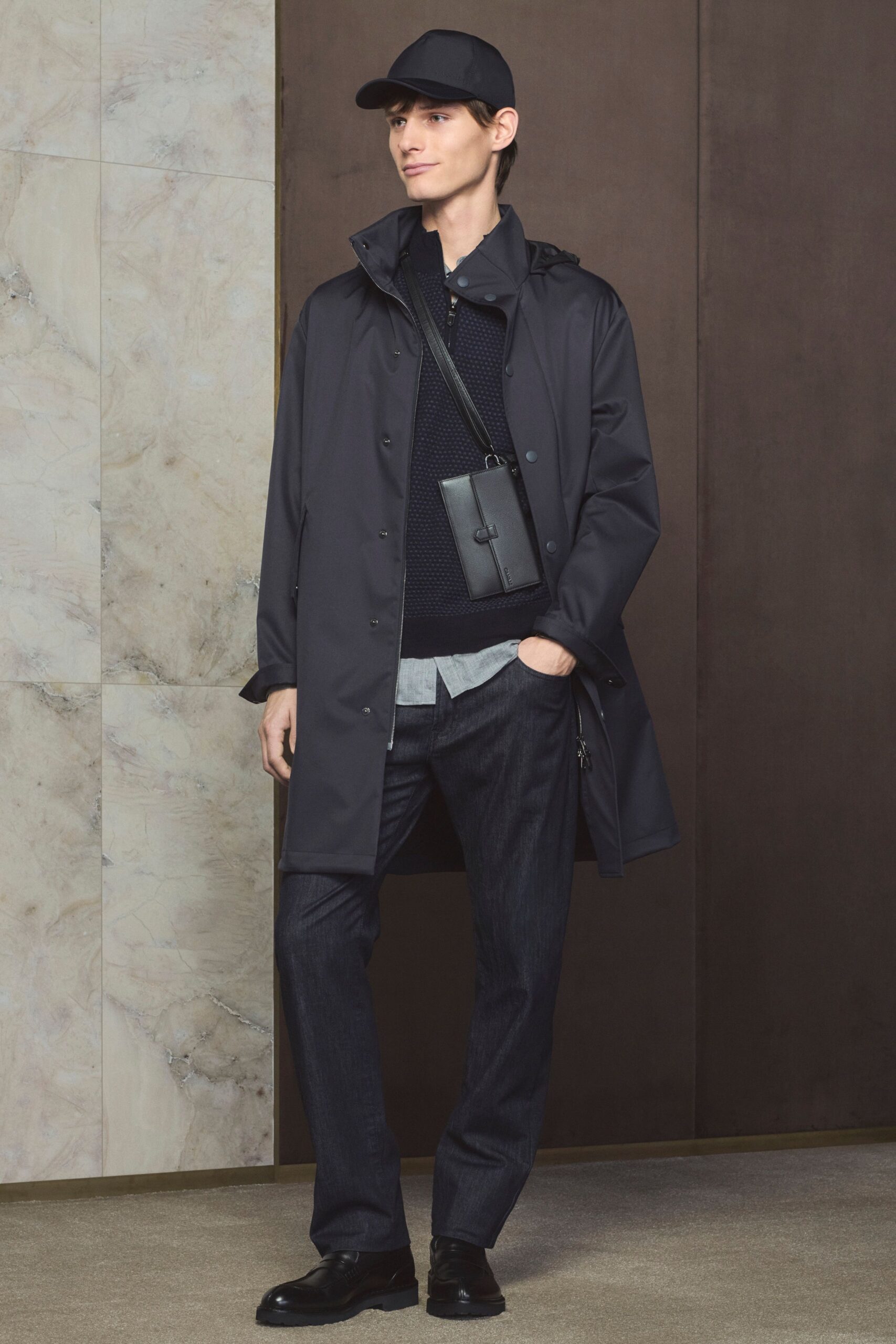 black vinyl coat with navy sweater