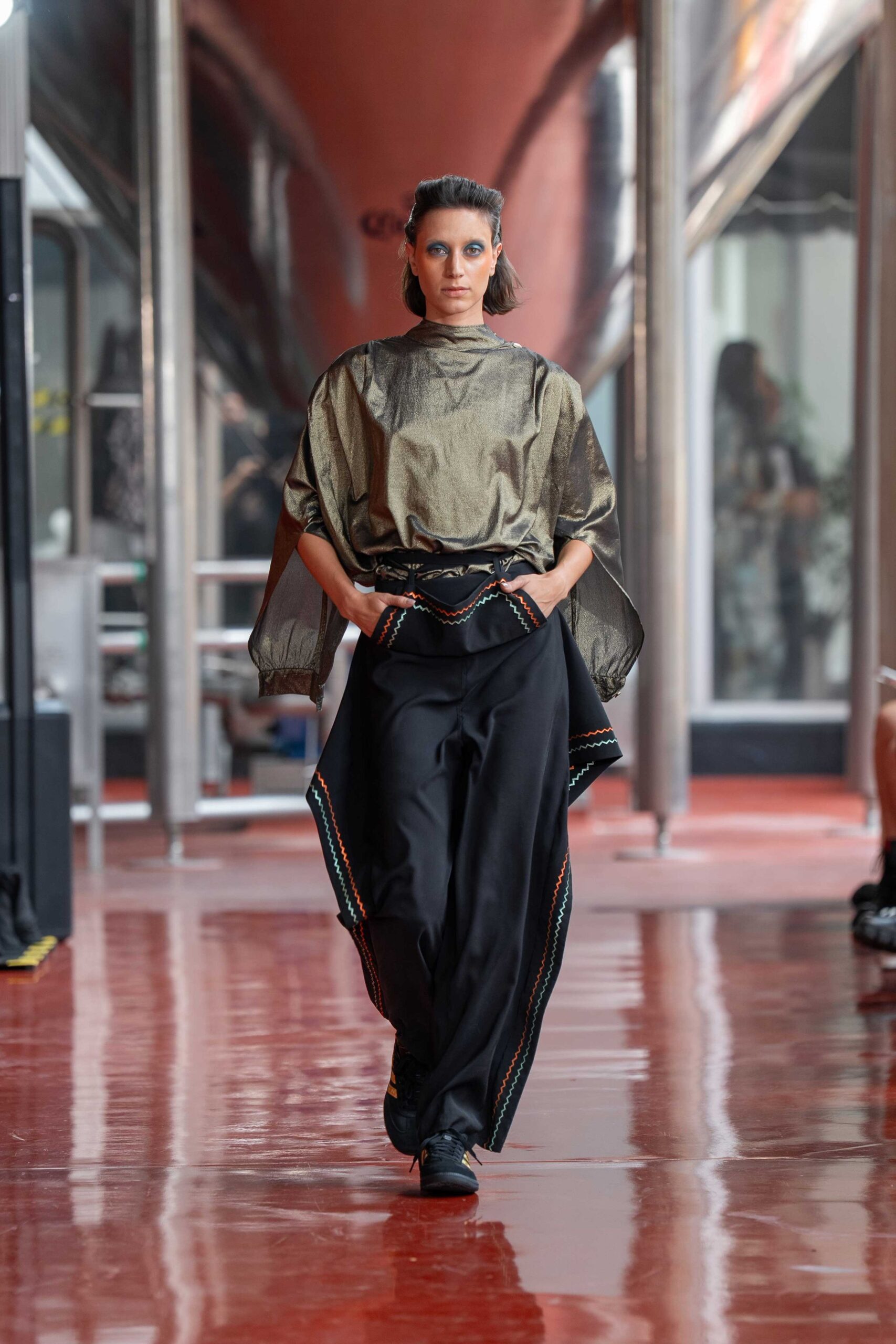 gold silk top with black pants