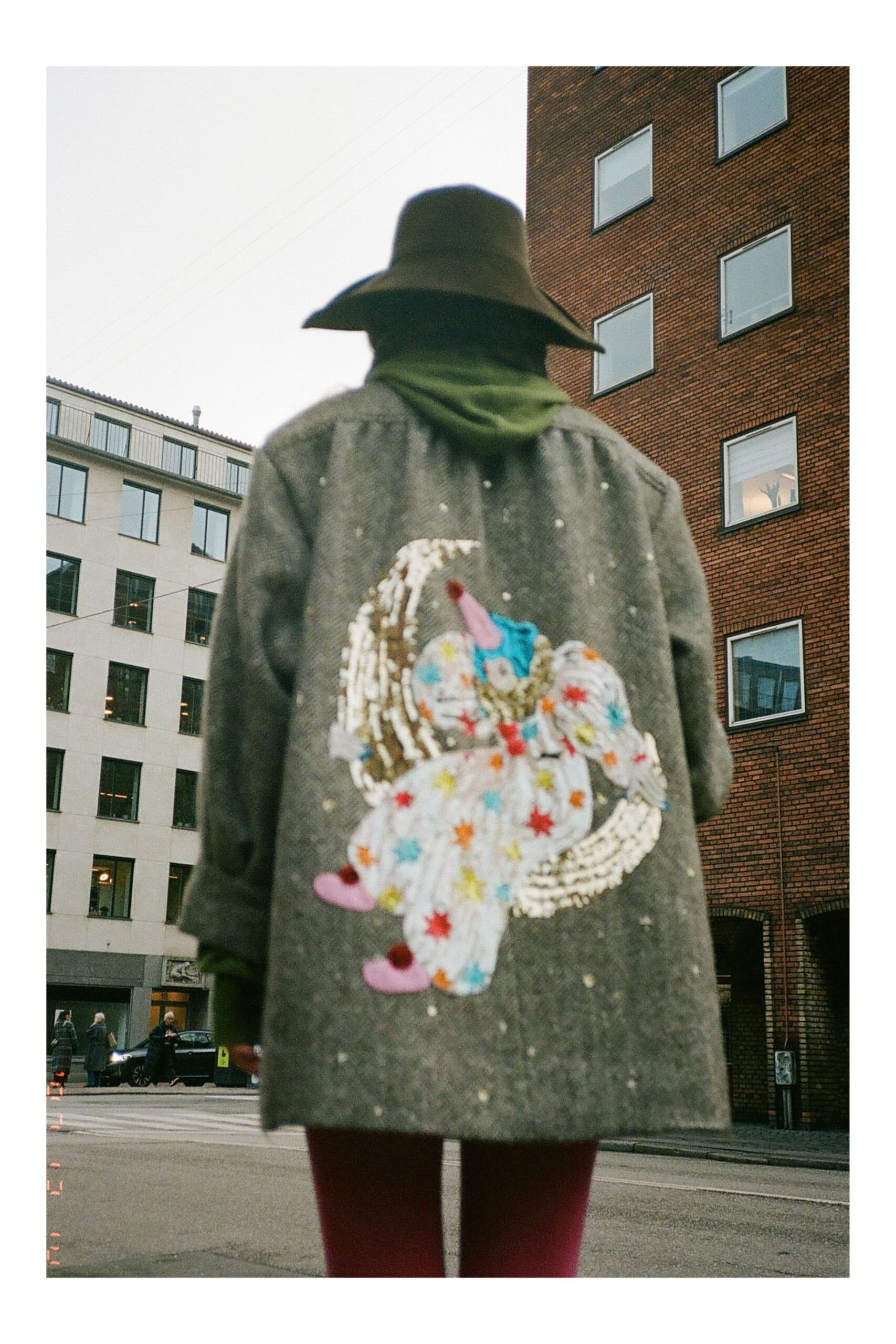 gray embroidered coat with green hoodie