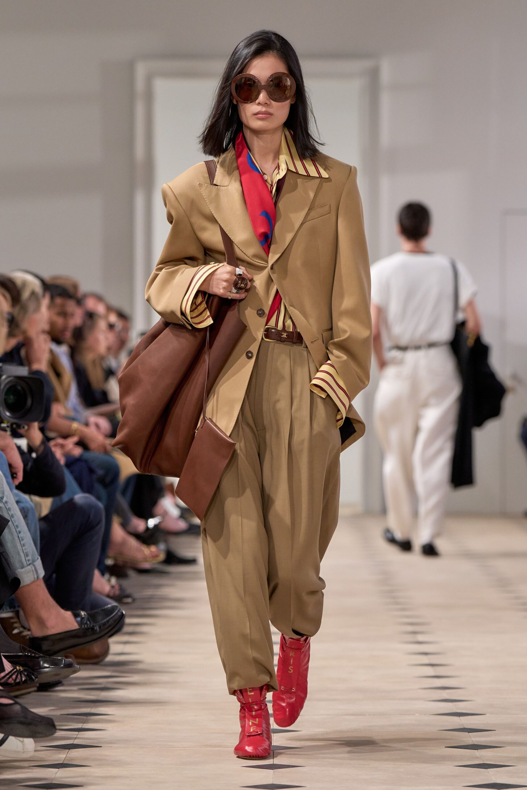 beige suit with red boots