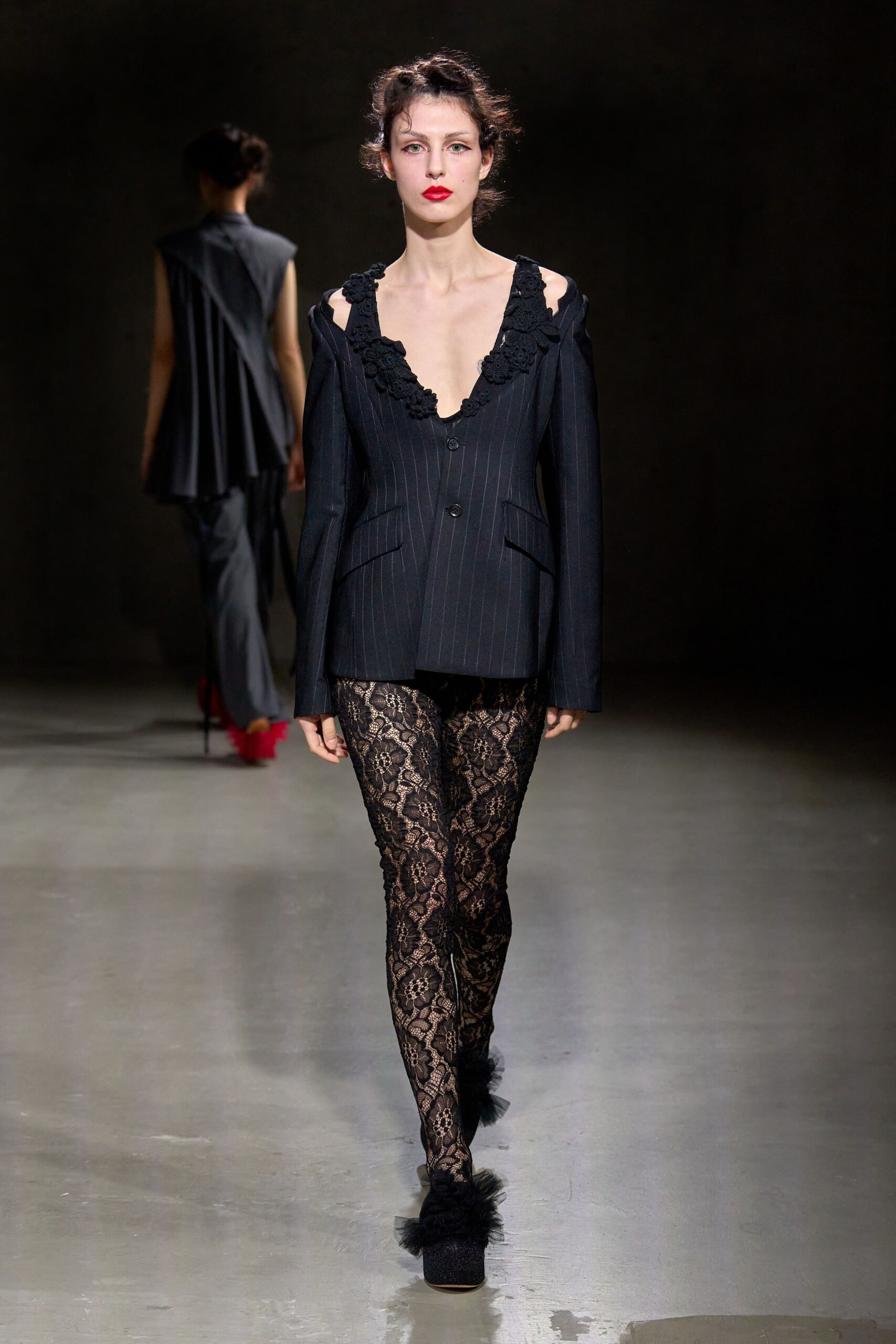 black fitted blazer with lace leggings