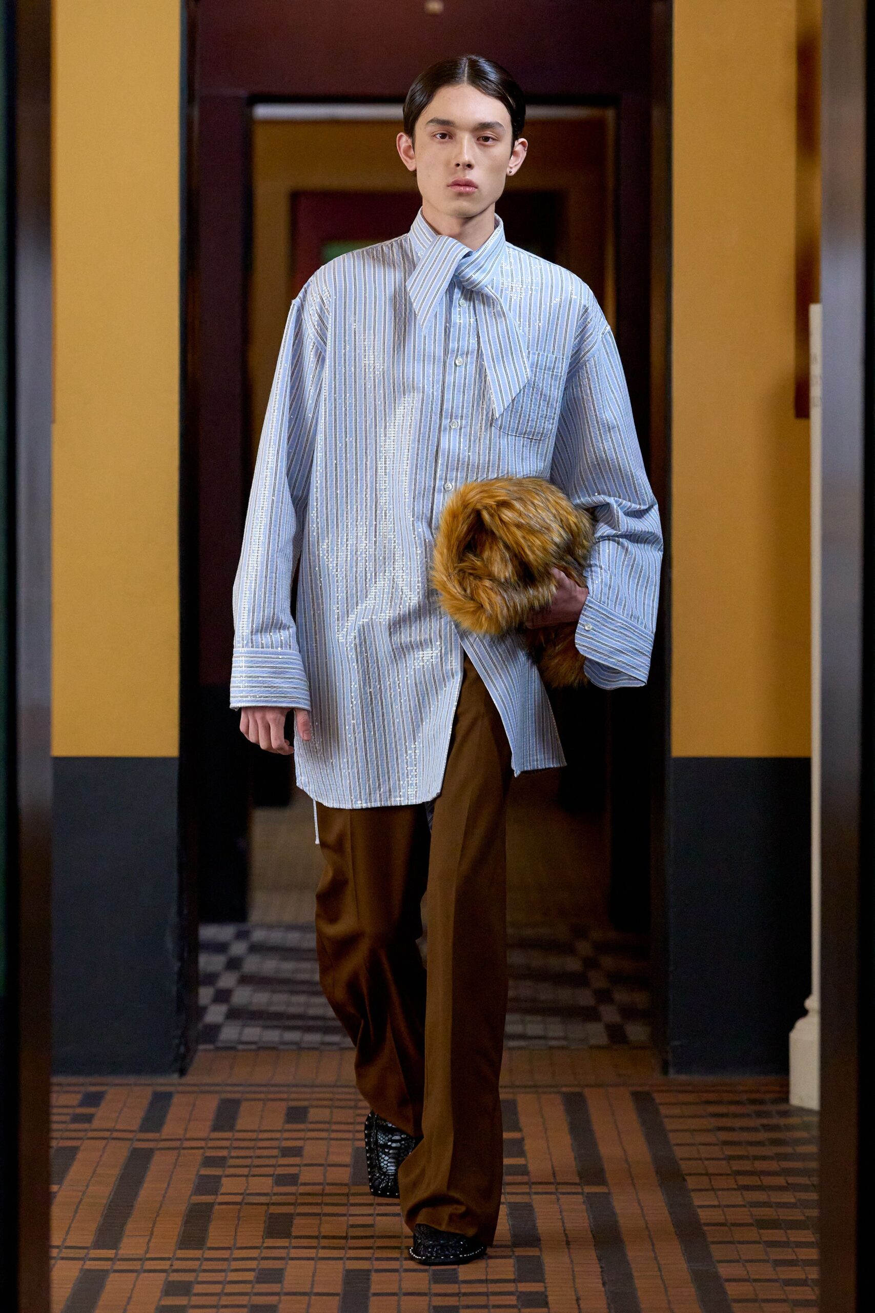 blue striped shirt with brown pants