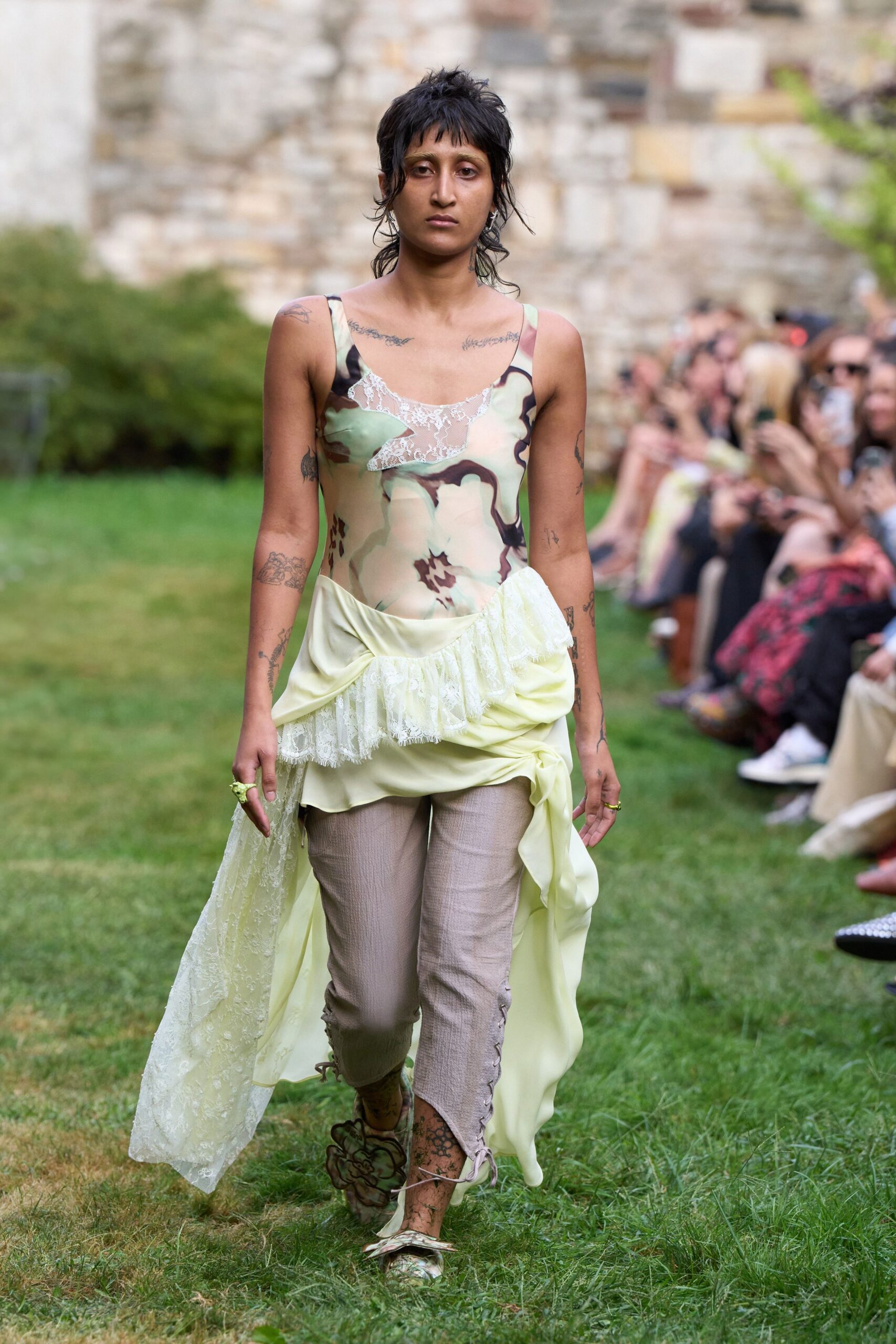 green pink layered dress with beige pants
