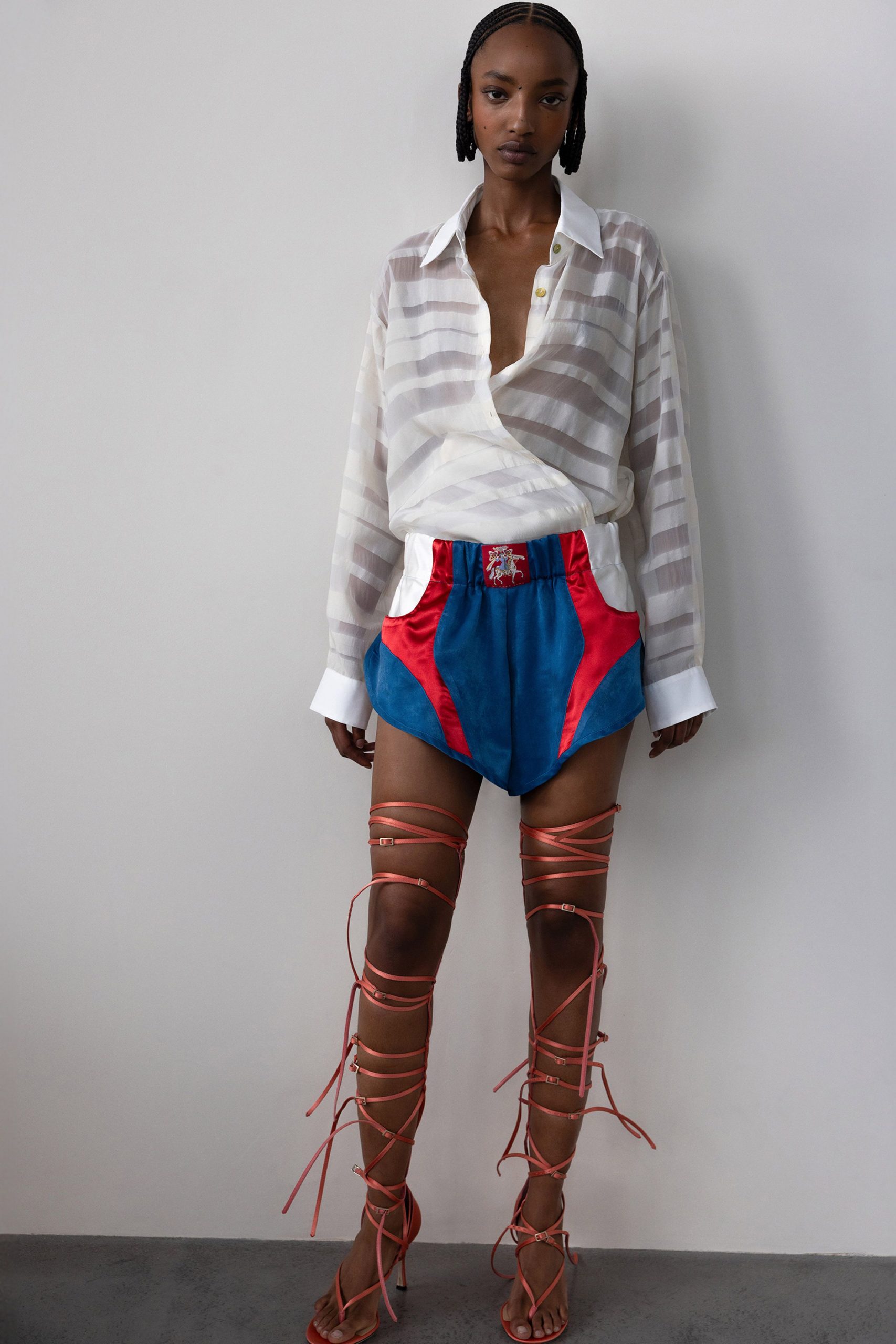 white striped shirt with blue shorts