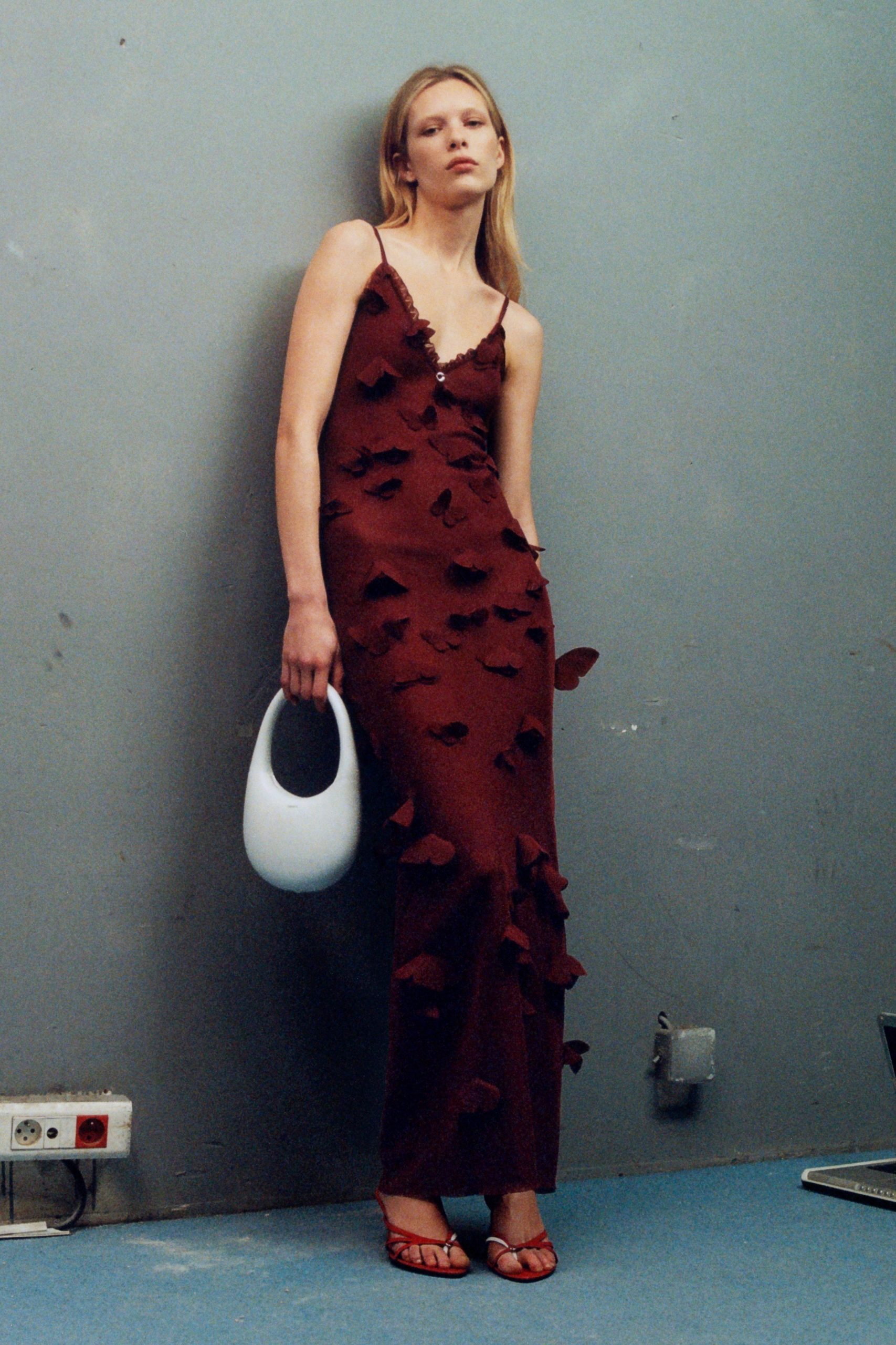 red silk sleeveless v-neck fitted embroidered maxi gown