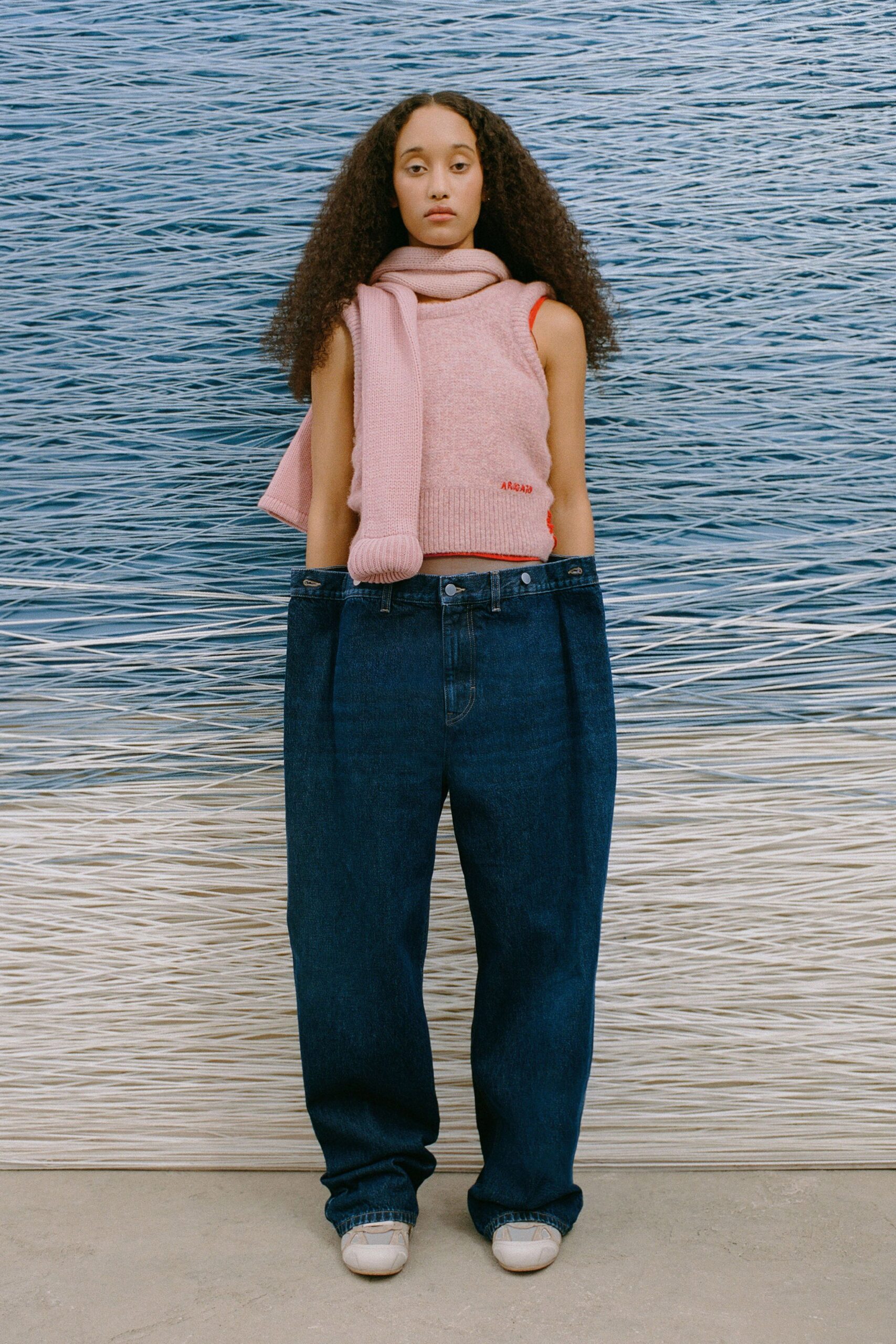 pink top with relaxed denim pants