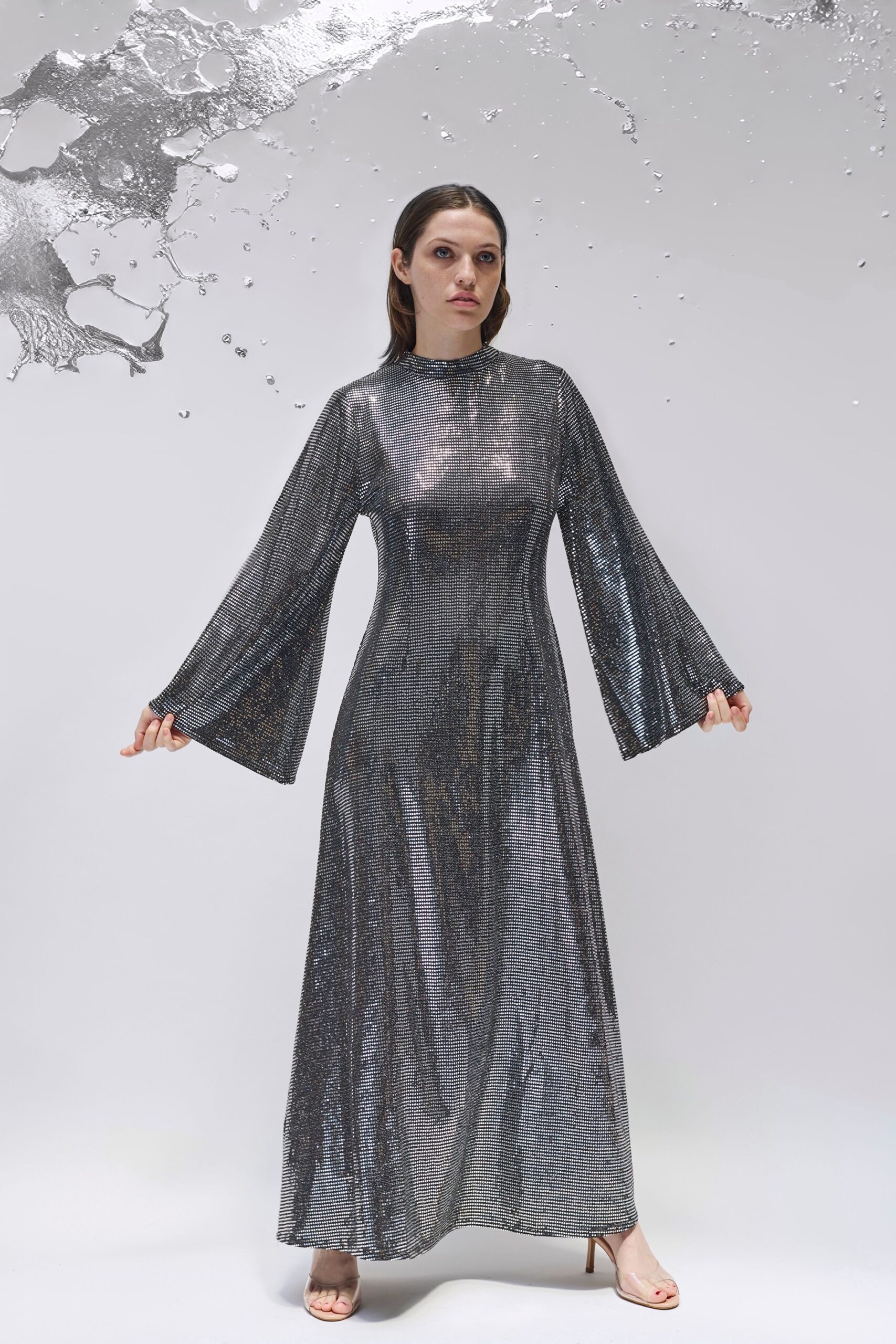 gray sequin long-sleeve high-neck fitted flowing shiny gown