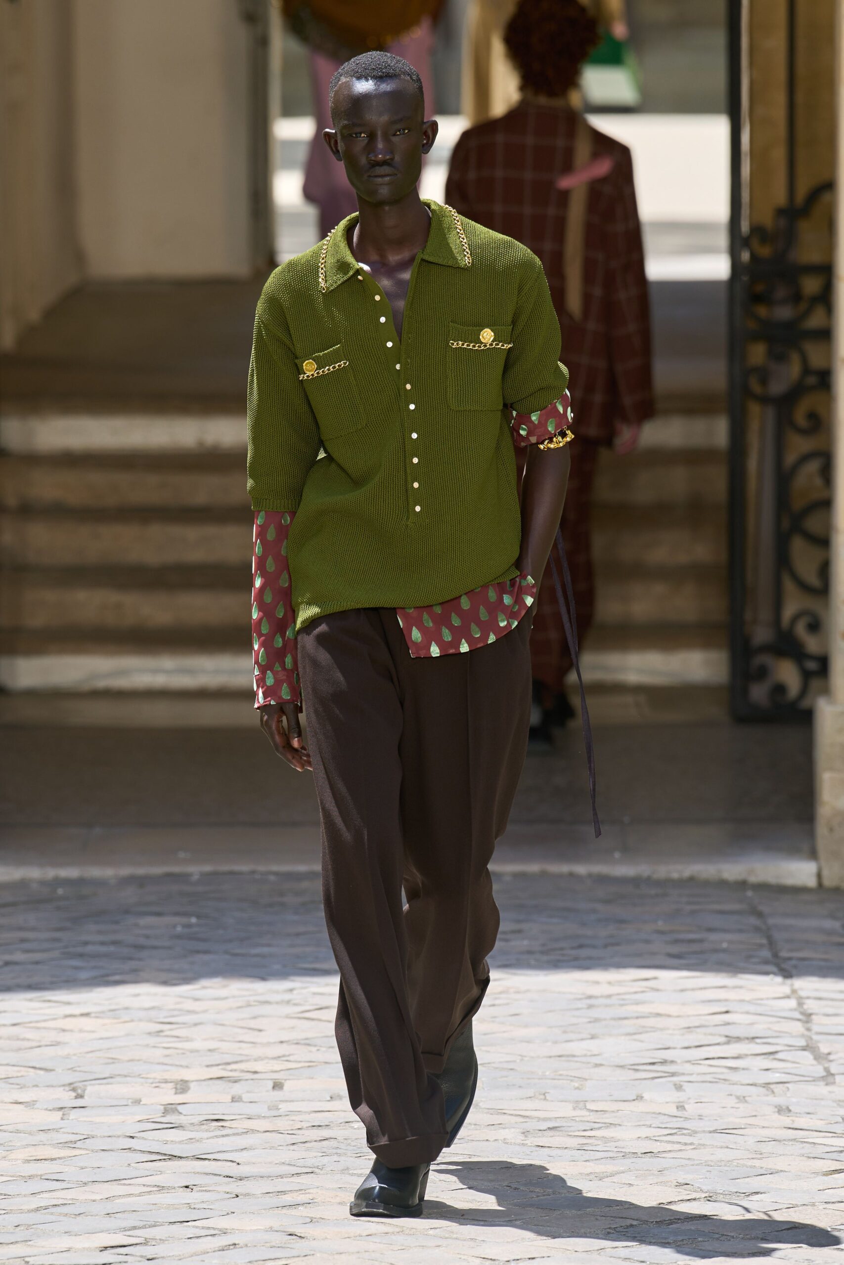 green shirt with brown pants
