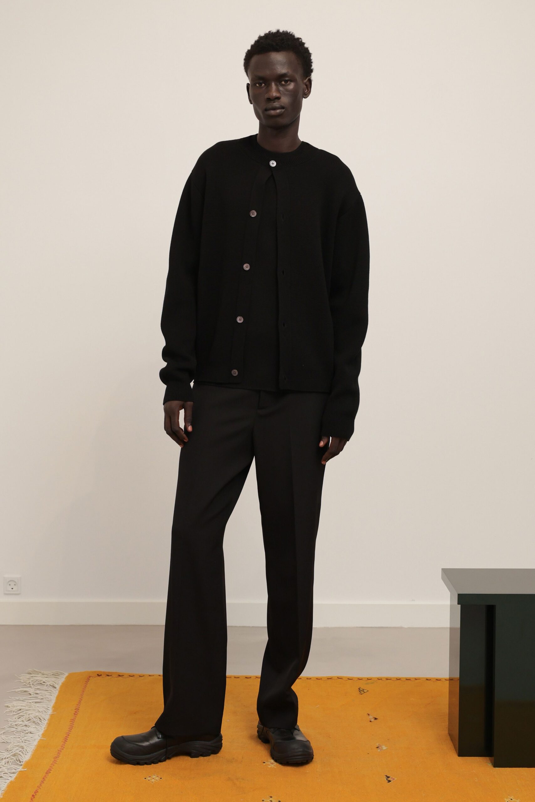 black knit long-sleeve collared oversized buttoned textured jacket