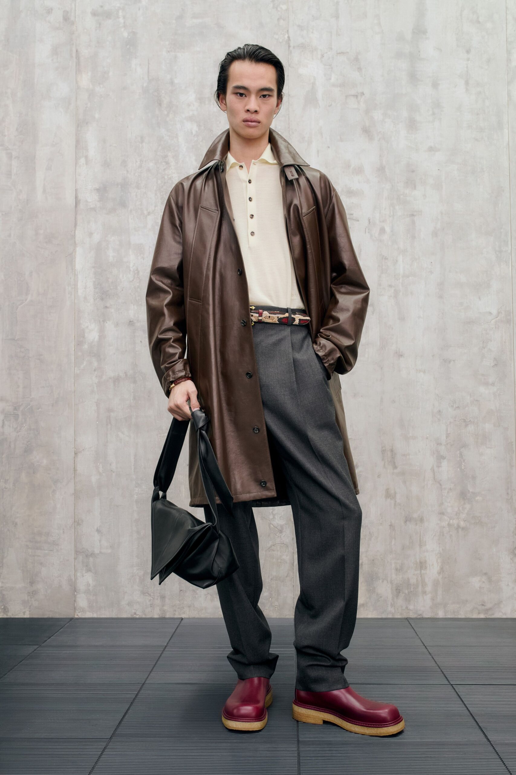 brown leather coat beige shirt gray pants