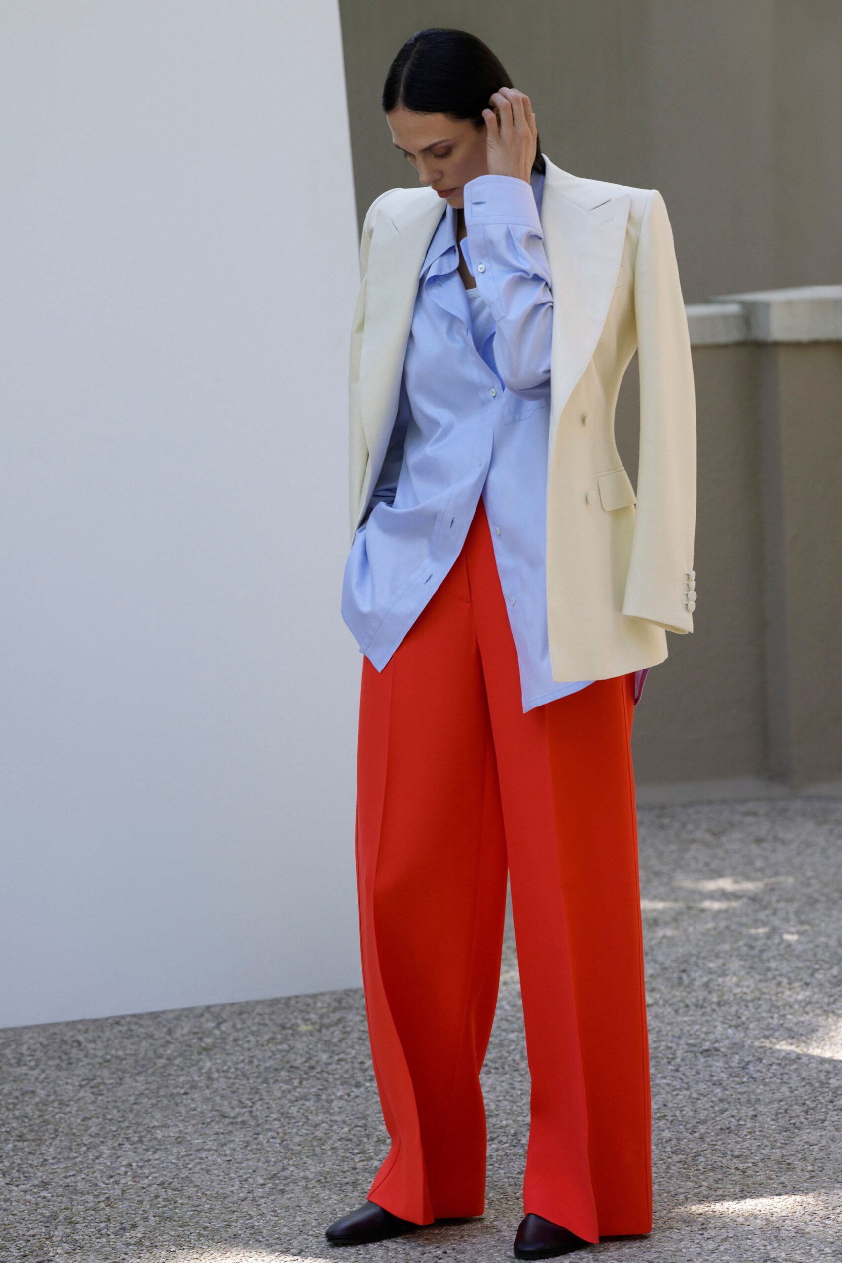 white tailored blazer blue shirt red pants