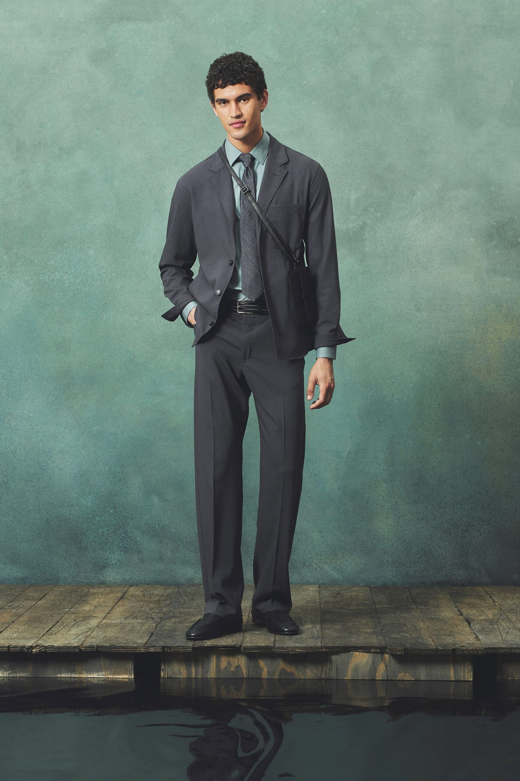gray tailored suit with blue shirt