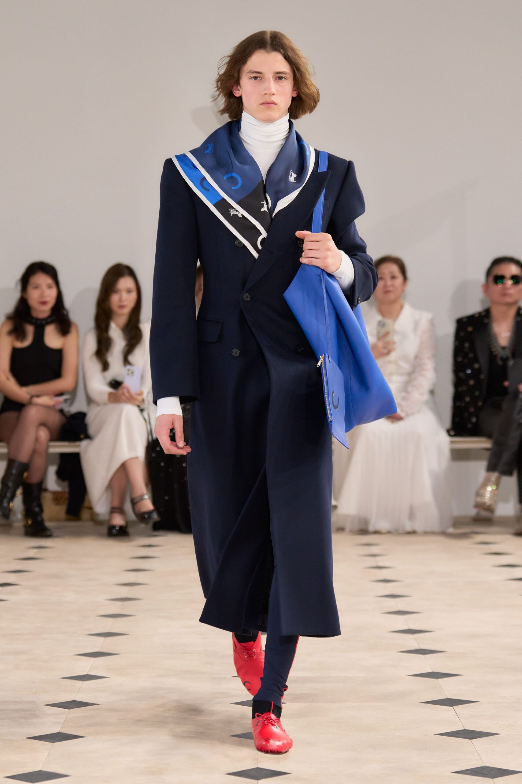 navy suit with scarf and red shoes