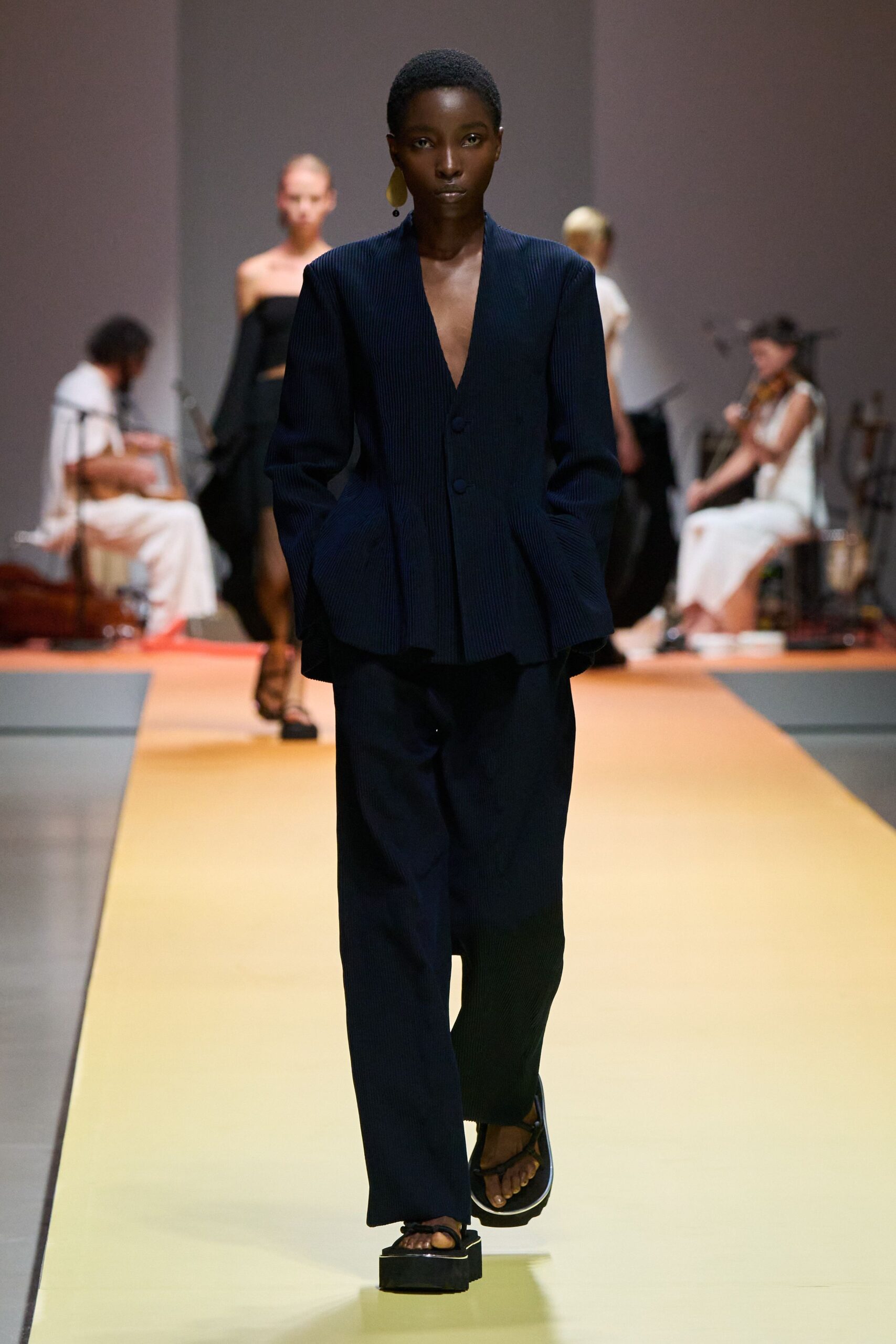 black tailored blazer and relaxed pants