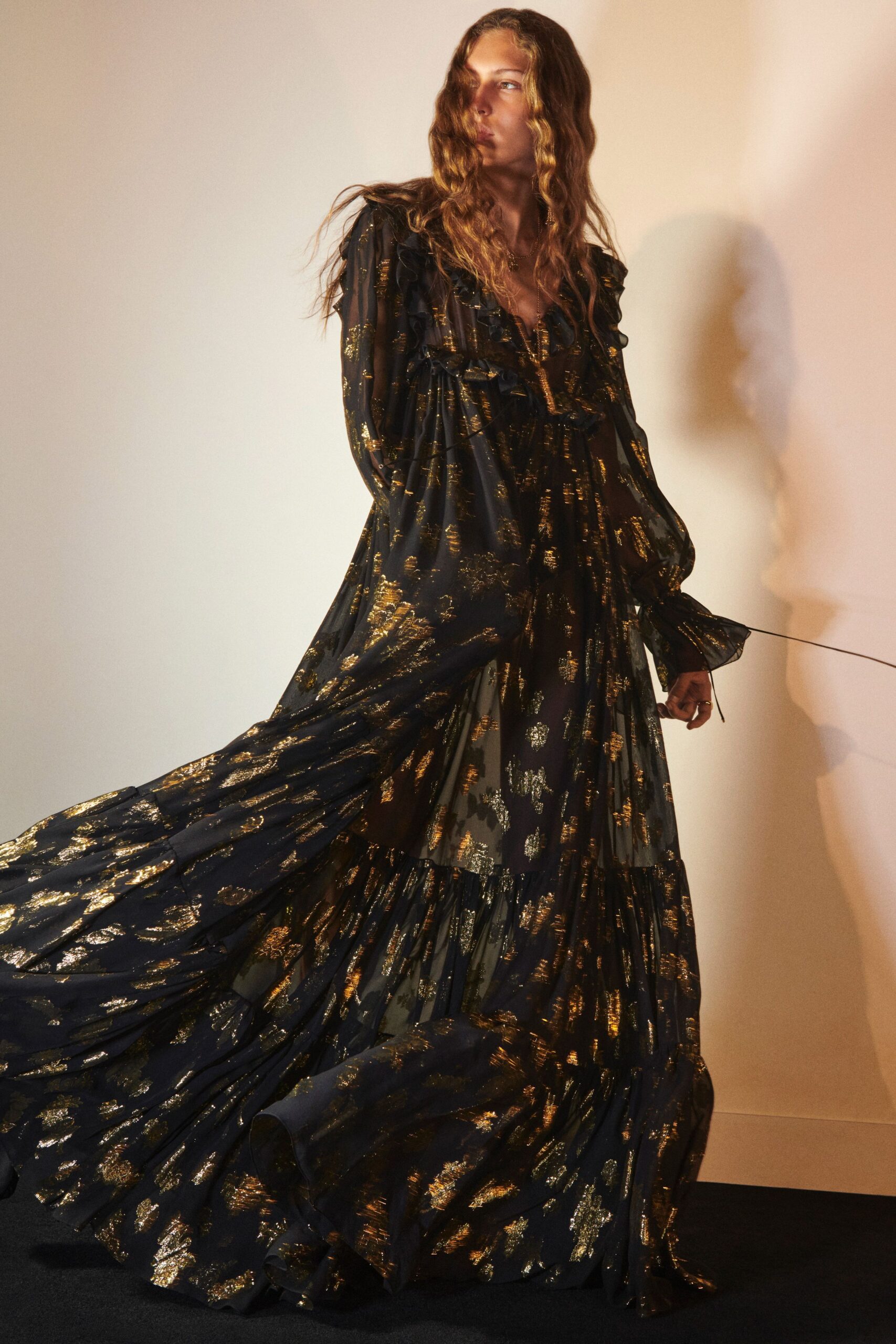 black and gold flowing gown