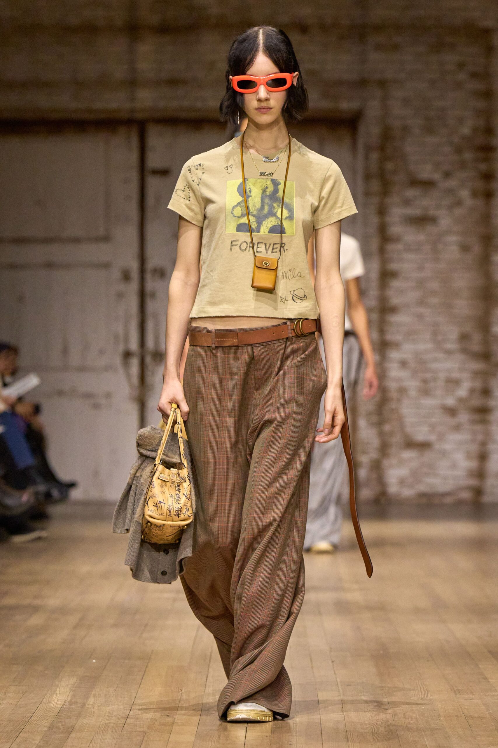 beige printed t-shirt with plaid pants