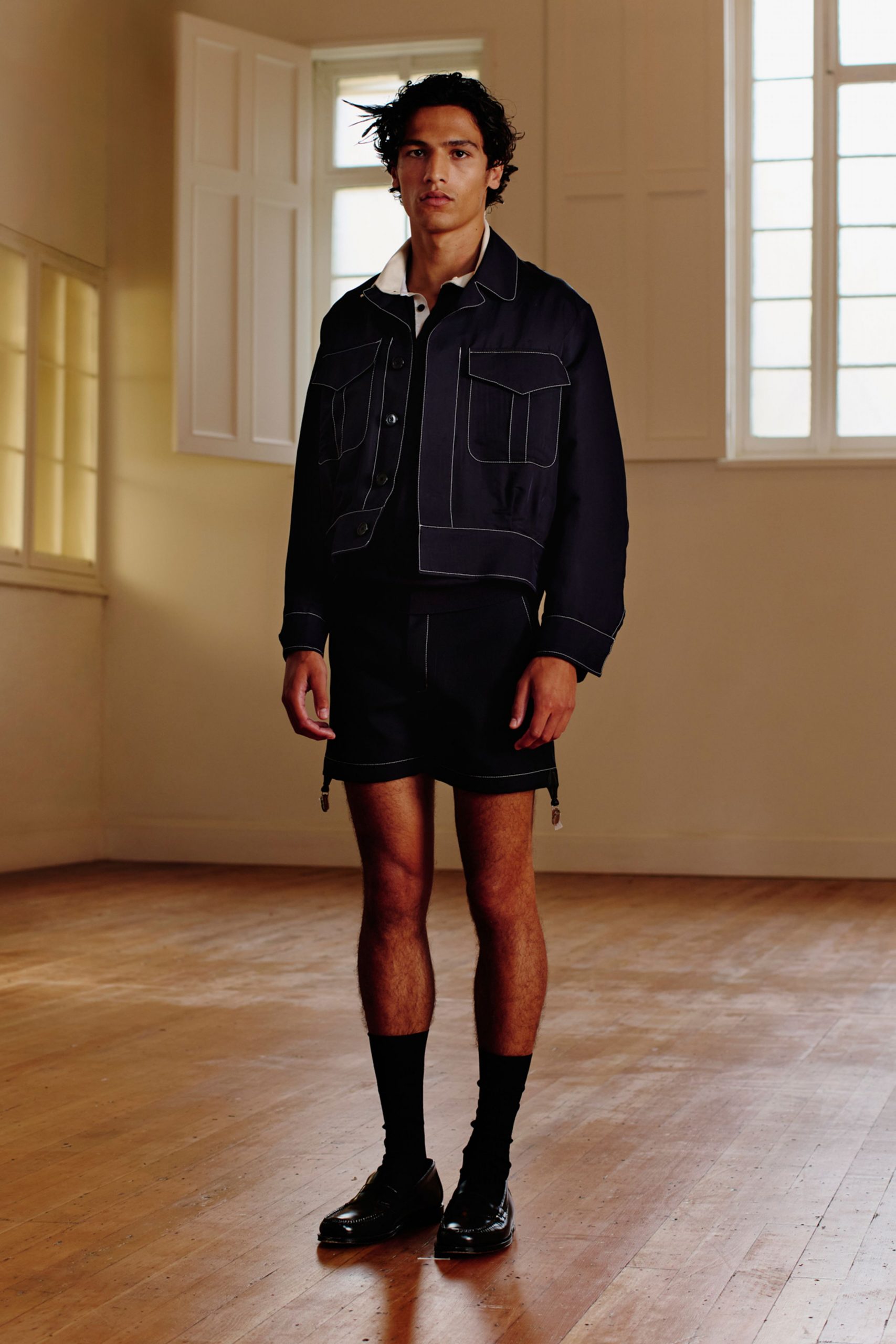black fitted jacket and shorts