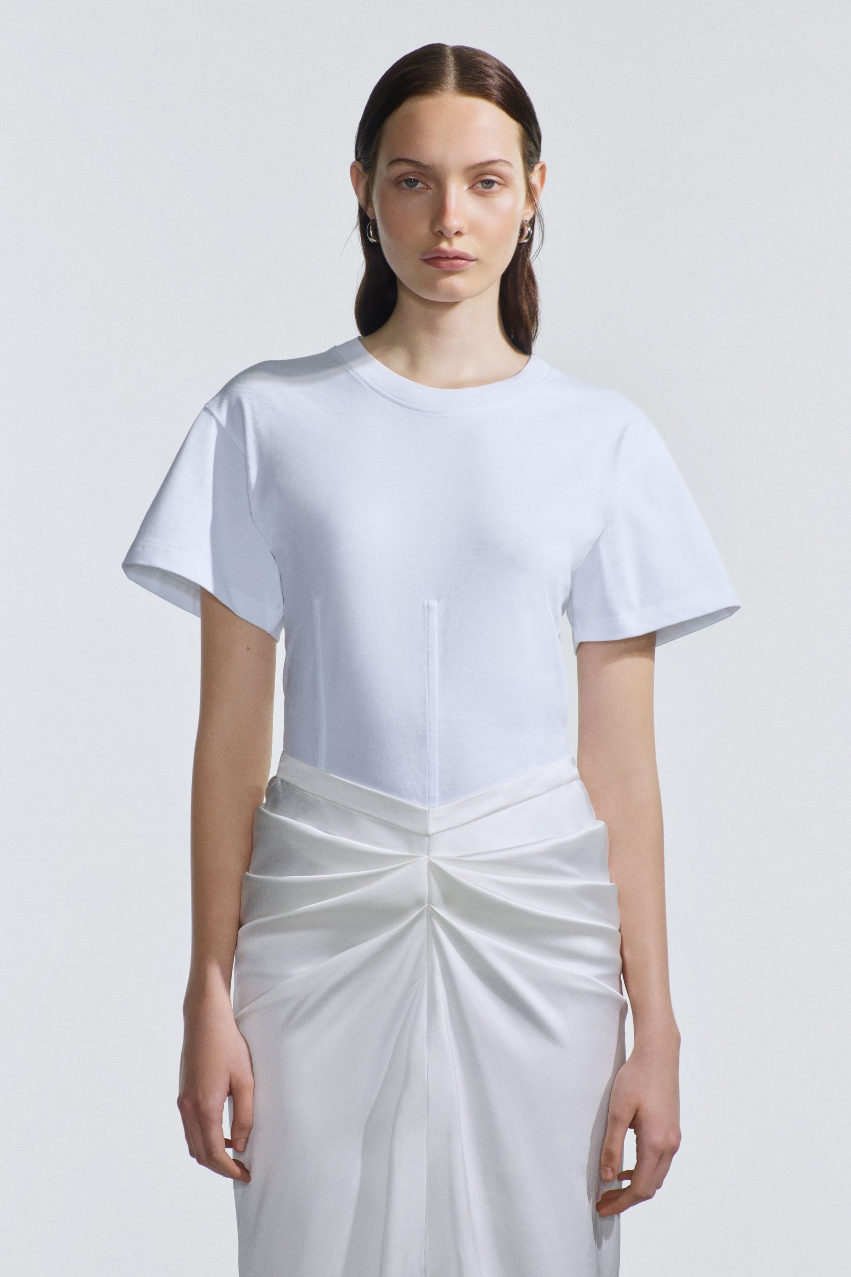 white fitted top and pleated skirt