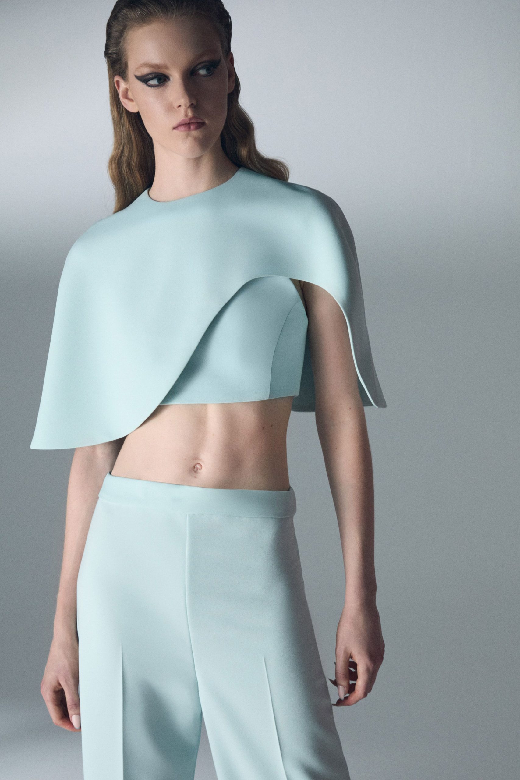 blue neoprene fitted top and tailored pants