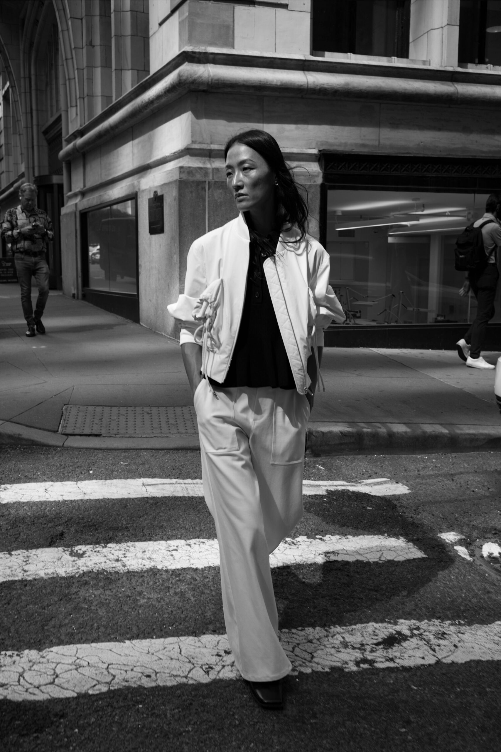 white jacket black top white pants