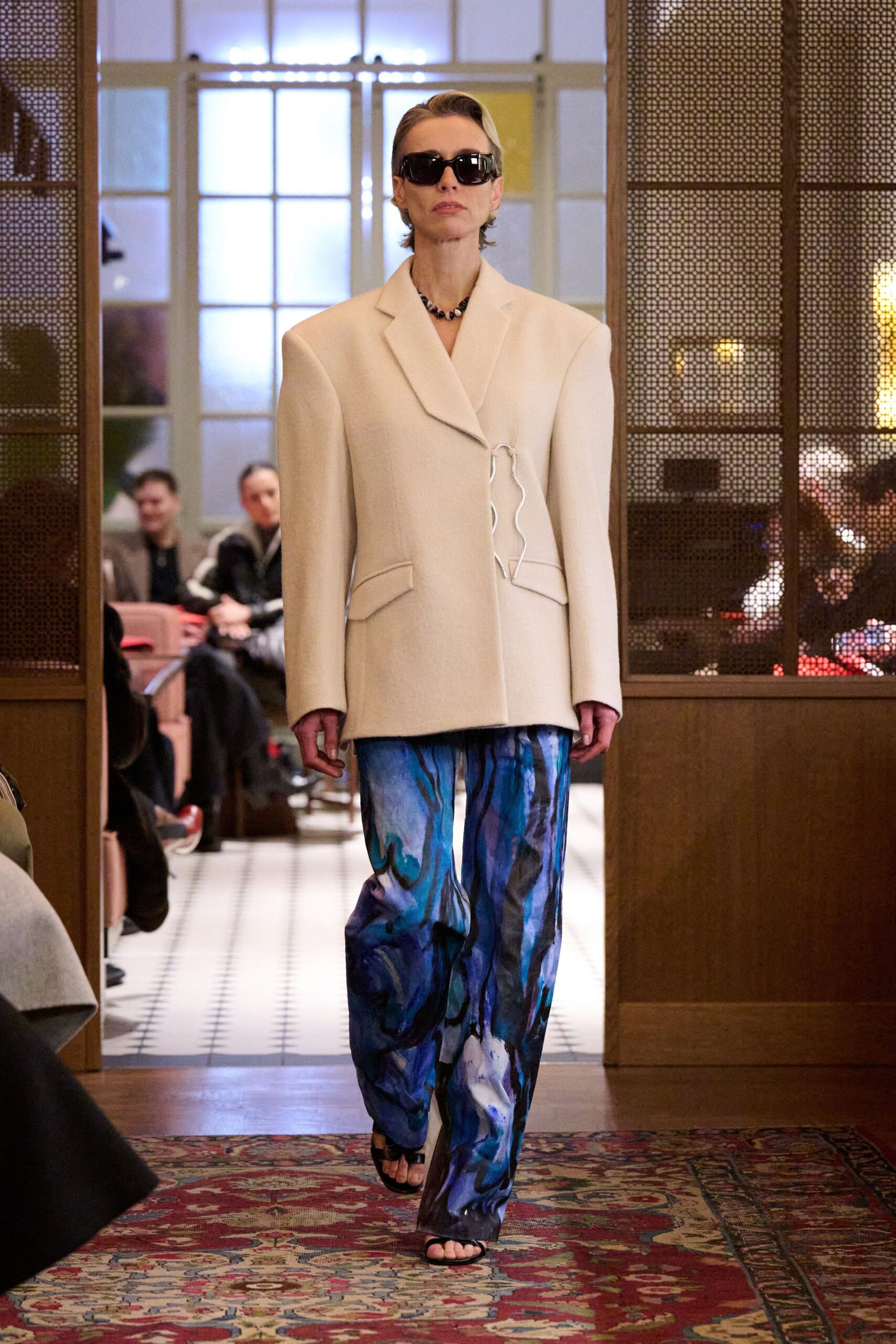 white structured blazer with printed pants