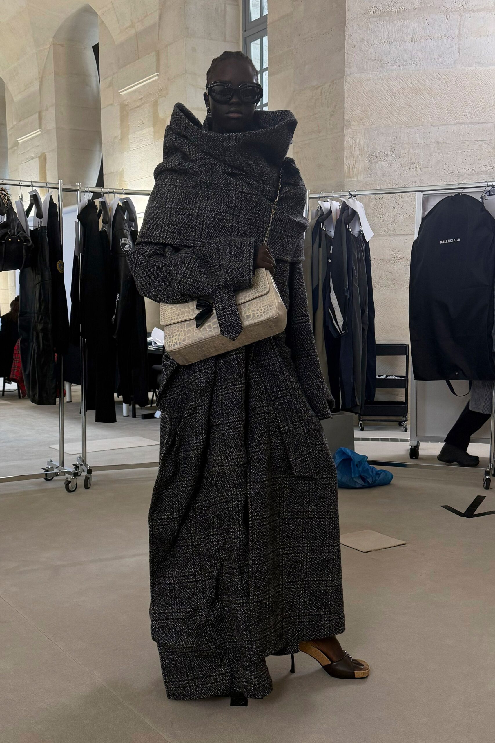 black wool long-sleeve collared relaxed belted layered coat