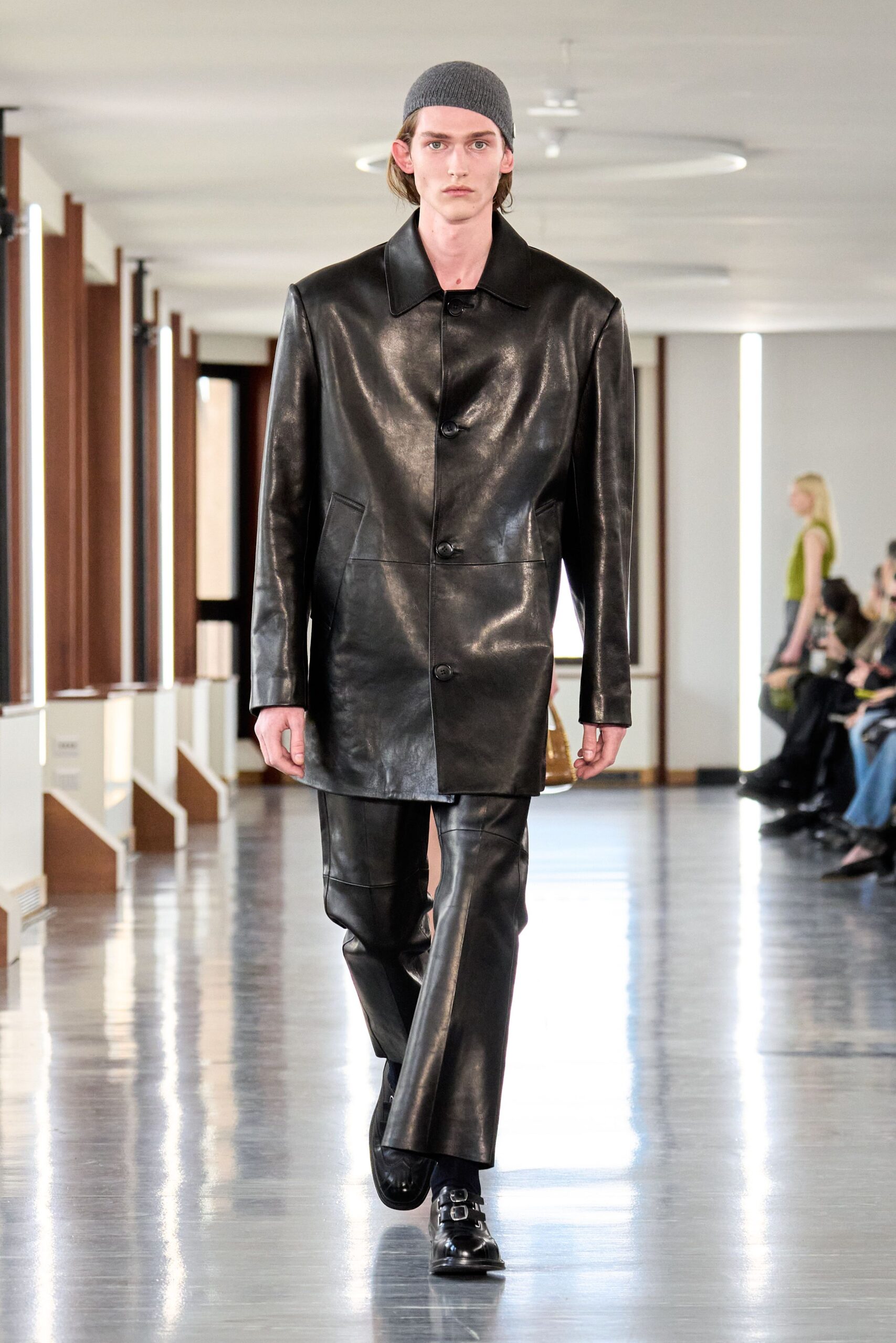 black leather long-sleeve collared oversized buttoned jacket
