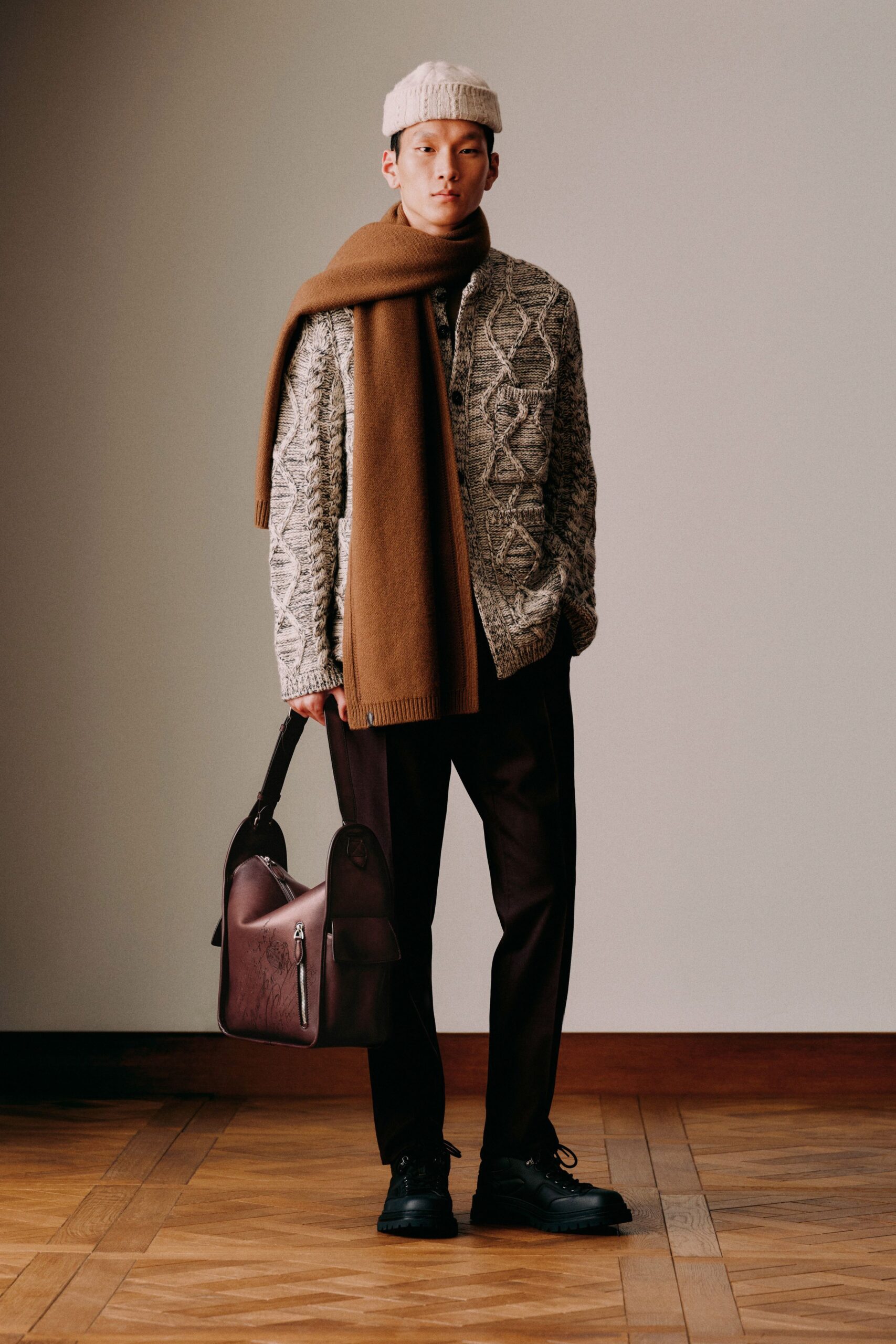 beige patterned sweater with black pants